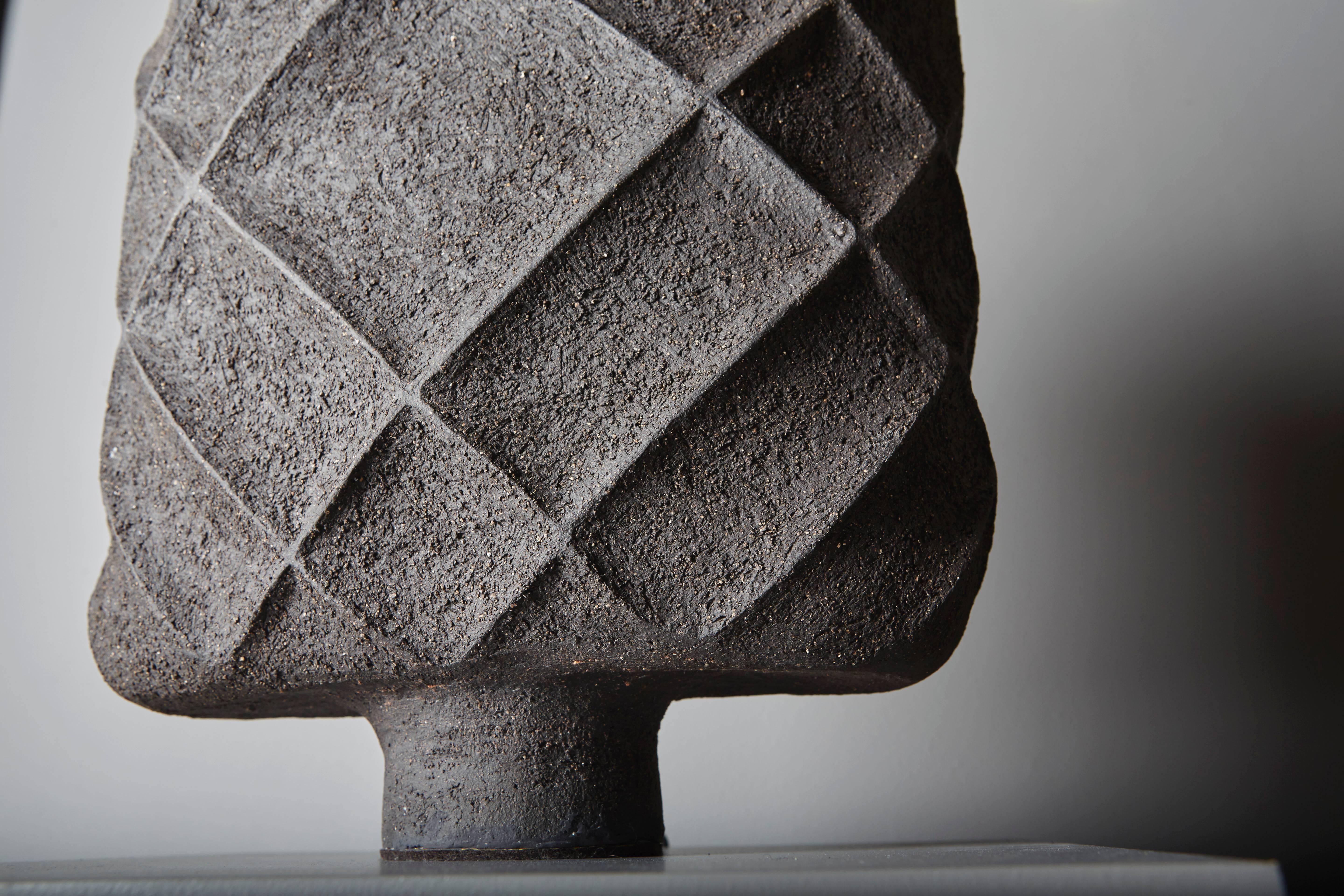 Black sandstone table lamps, hand-sculpted.

French work by ceramist Isabelle Sicart, 2015.
    
