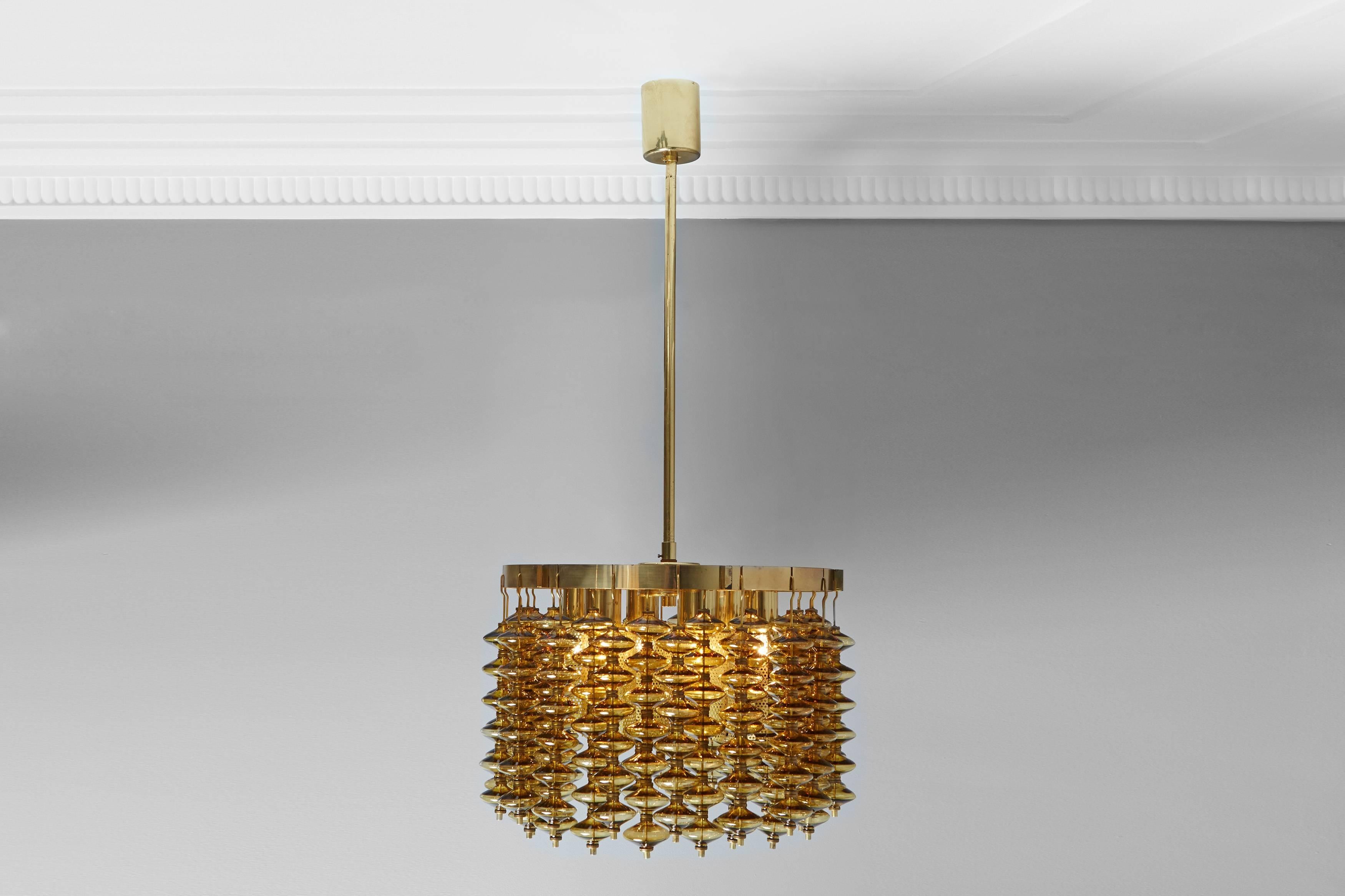 Pair of brass chandeliers decorated with smoked glass spools.
Swedish work by Hans-Agne Jakobsson, circa 1970.
Rewired.