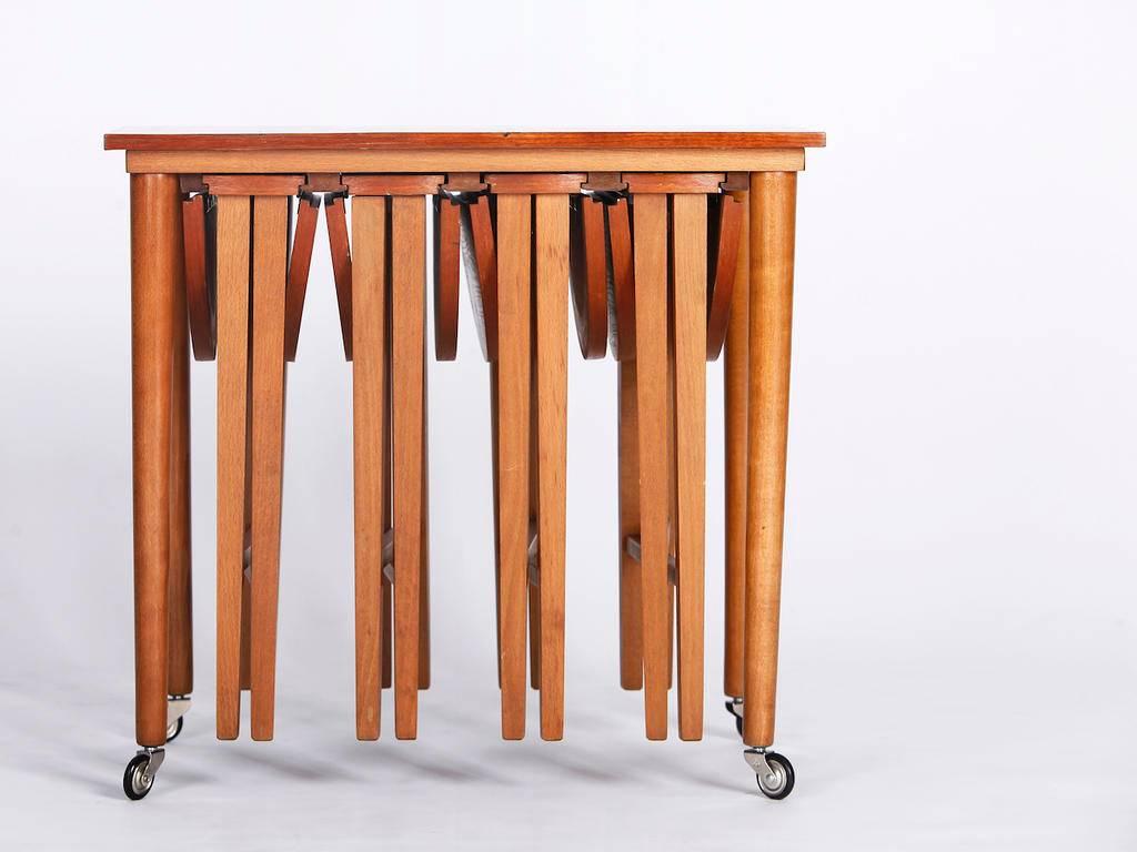 This set of five teak nesting tables was designed by Poul Hundevad in the 1960s for Novy domov in former Czechoslovakia.
