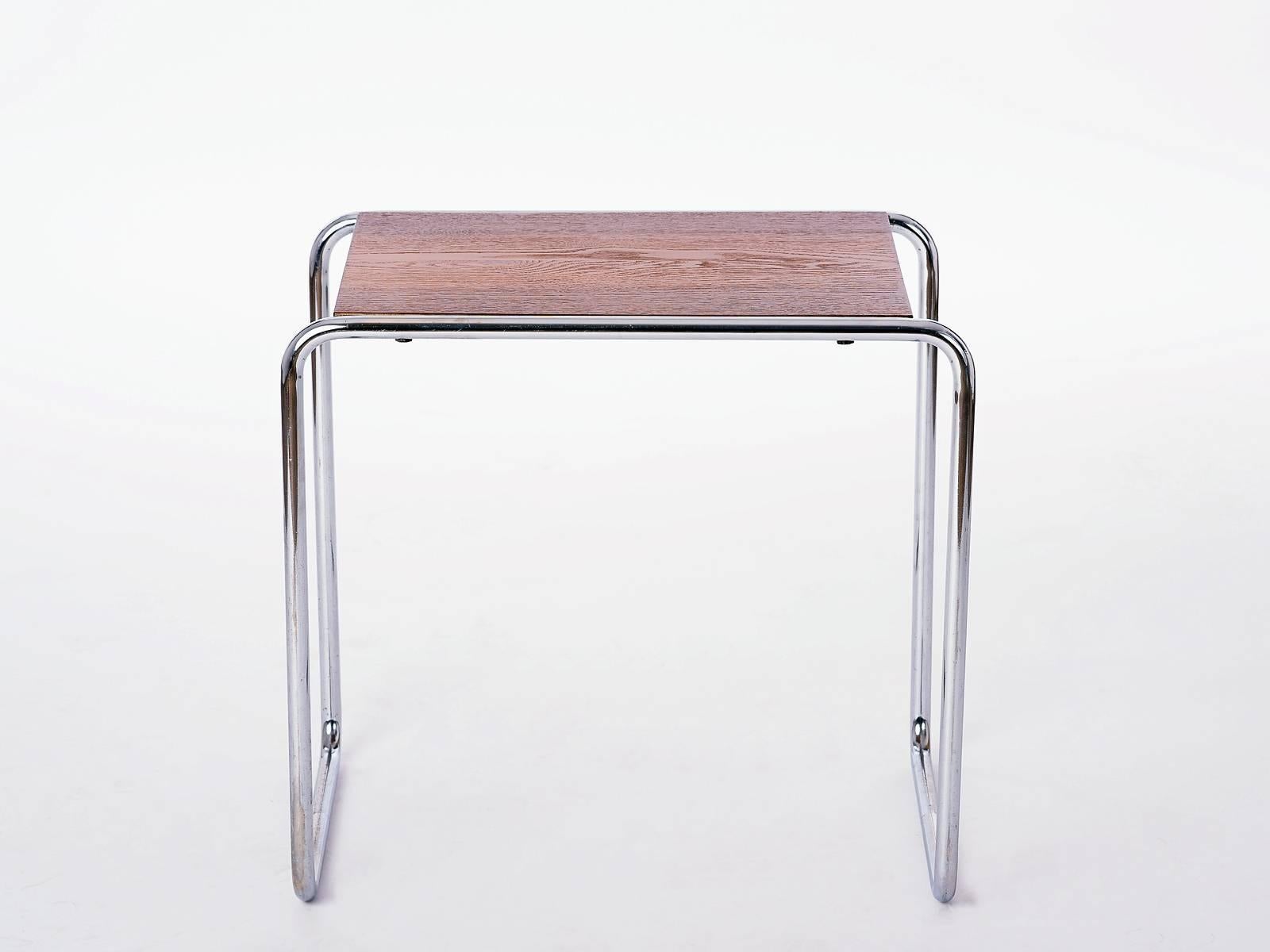 This chromed tubular steel table B9 was designed by the German Bauhaus designer Marcel Breuer for Thonet in the 1930s.
The wooden desk has been restored. The original chrome is in a very good
condition. Collector's item!
