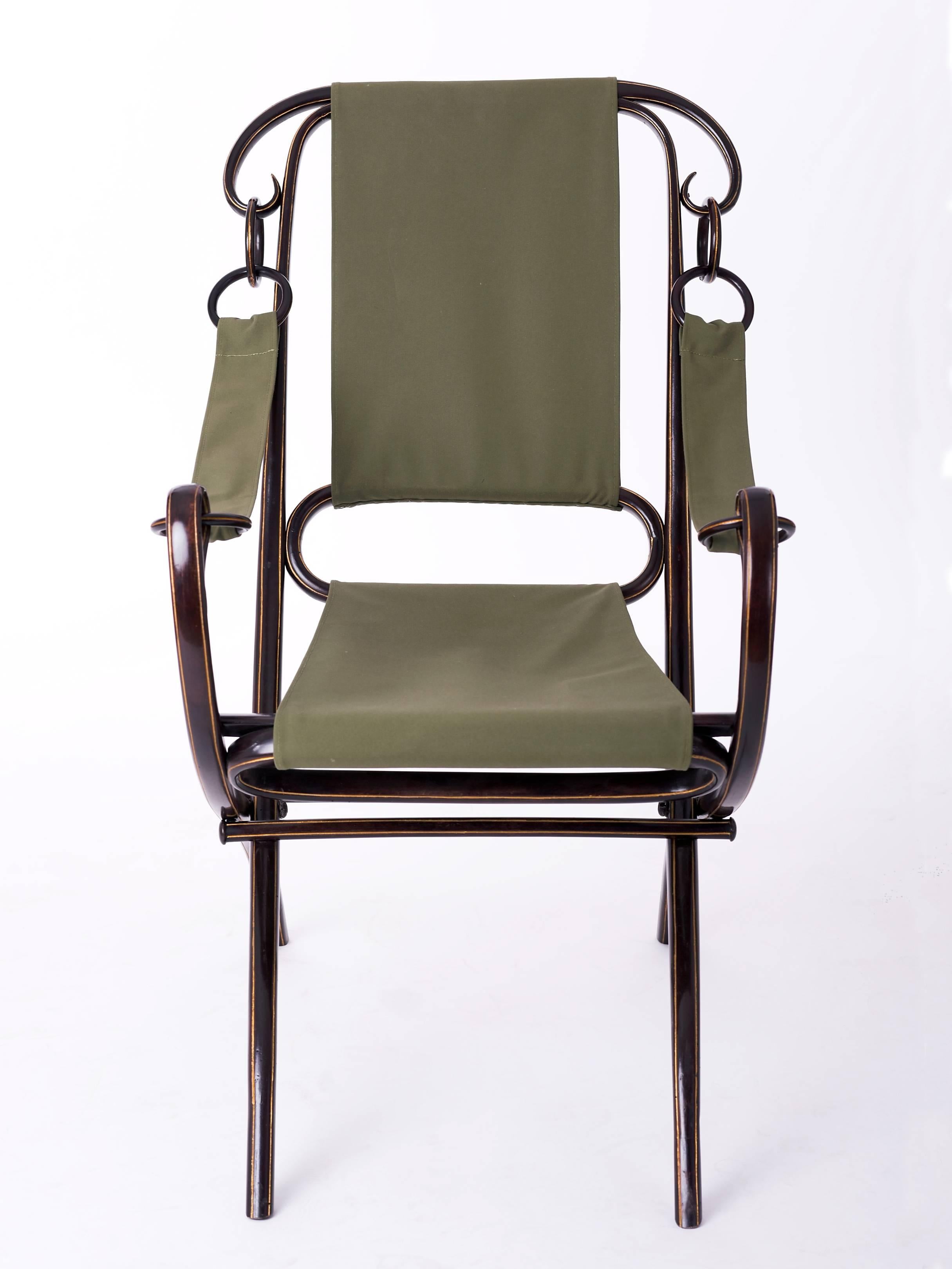 Folding armchair from Thonet No.2 
designed before 1885.
Beech, new dark brown stained and with platinum gold lines decor.
New green fabric cover.

We offer Shop To Door delivery worldwide. Please ask for a quote.
   
