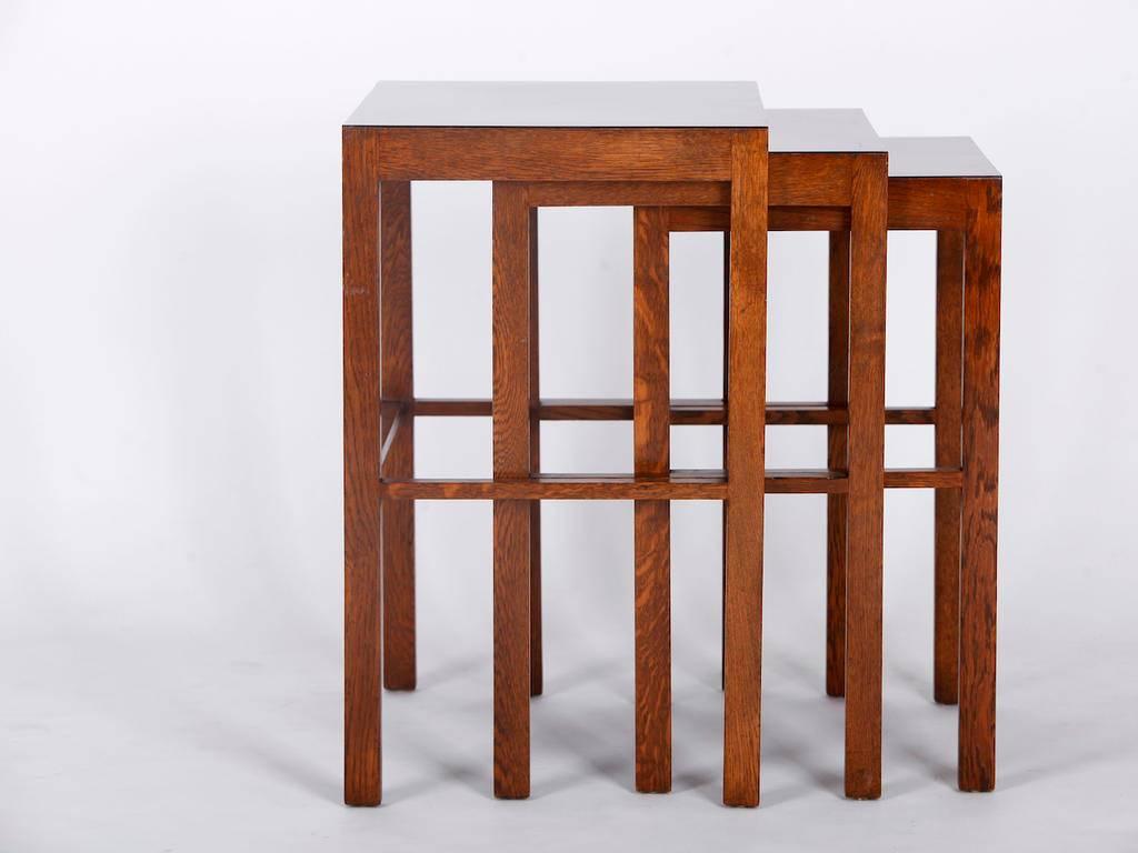 A set of three nesting tables, model no. 50, designed by Jindrich Halabala for UP Zavody, Brno in the 1930s. Dark stained and laquered beech, dark brown Bakelite tops measures: height: 66, 63, 60 cm
width: 55, 49,43cm
depth: 40,37,34cm