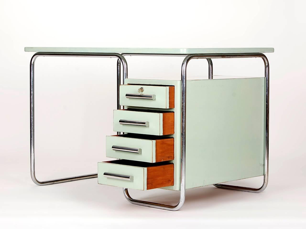 Desk with a frame in tubular chromed steel. Manufactured by Vichr & Co., Prague, in the 1930s.
Very good original condition with original varnish. Tubular steel with original chrome plating and patina. Fully cleaned.

We offer shop to door