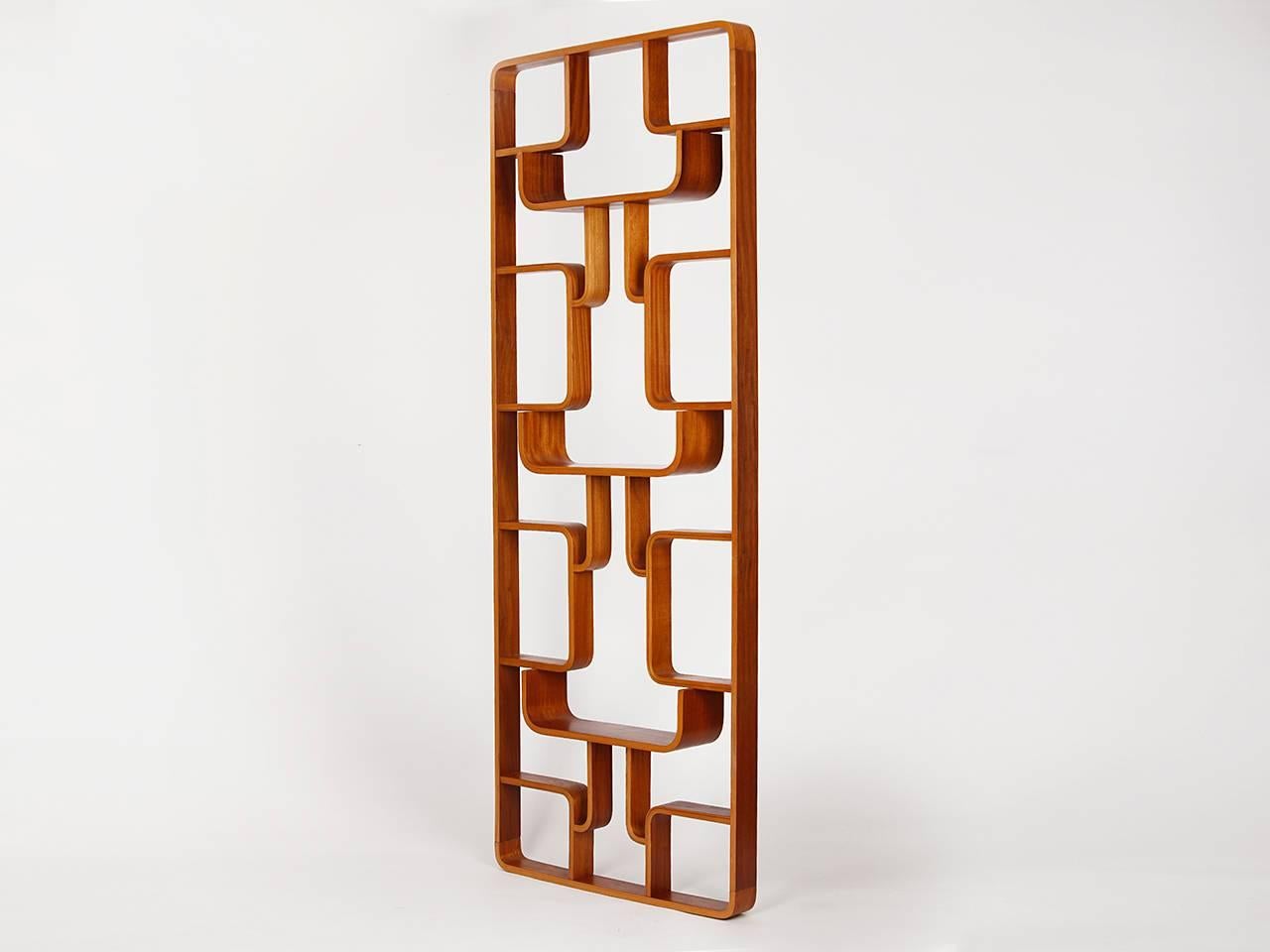 This mahogany room divider from the 1960s was designed by Ludvik Volak for Drevopodnik Holesov, in Czechoslovakia.

 