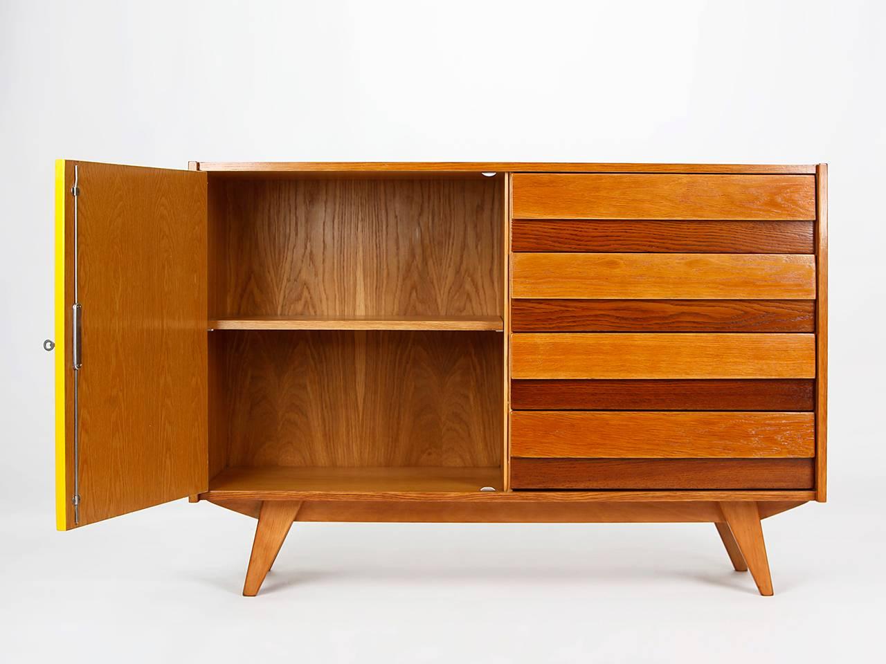 Midcentury sideboard by Jiri Jiroutek for Interier Praha, dating from the 1960s, with five drawers and yellow doors, from the former Czechoslovakia. Completely restored. 

 
