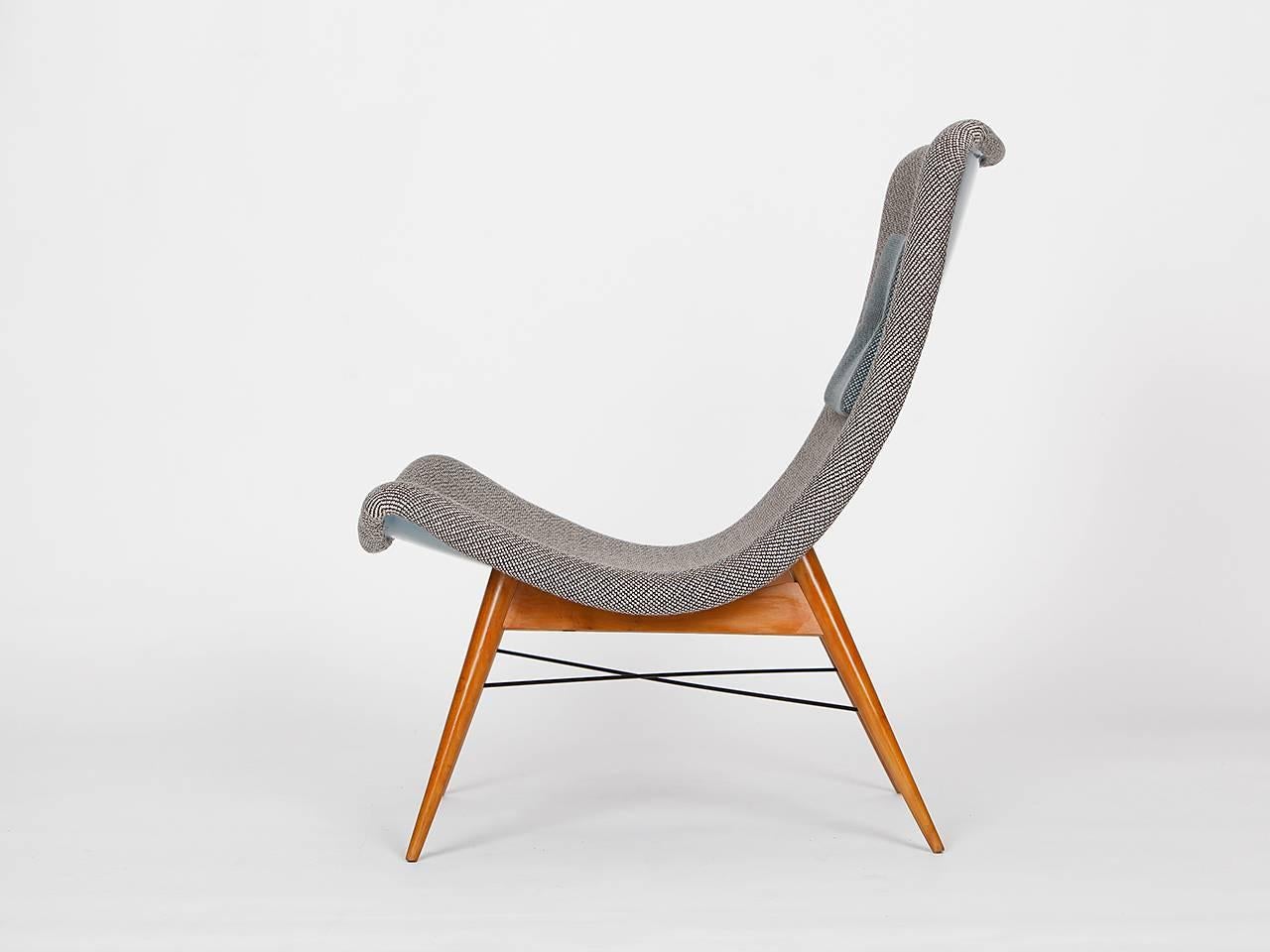 This lounge chair was designed in the 1960s by Miroslav Navratil for Cesky Nabytek in former Czechoslovakia. The frame is made of plastic laminate and the legs are made from beech. Completely restored and newly reupholstered in material from Dutch