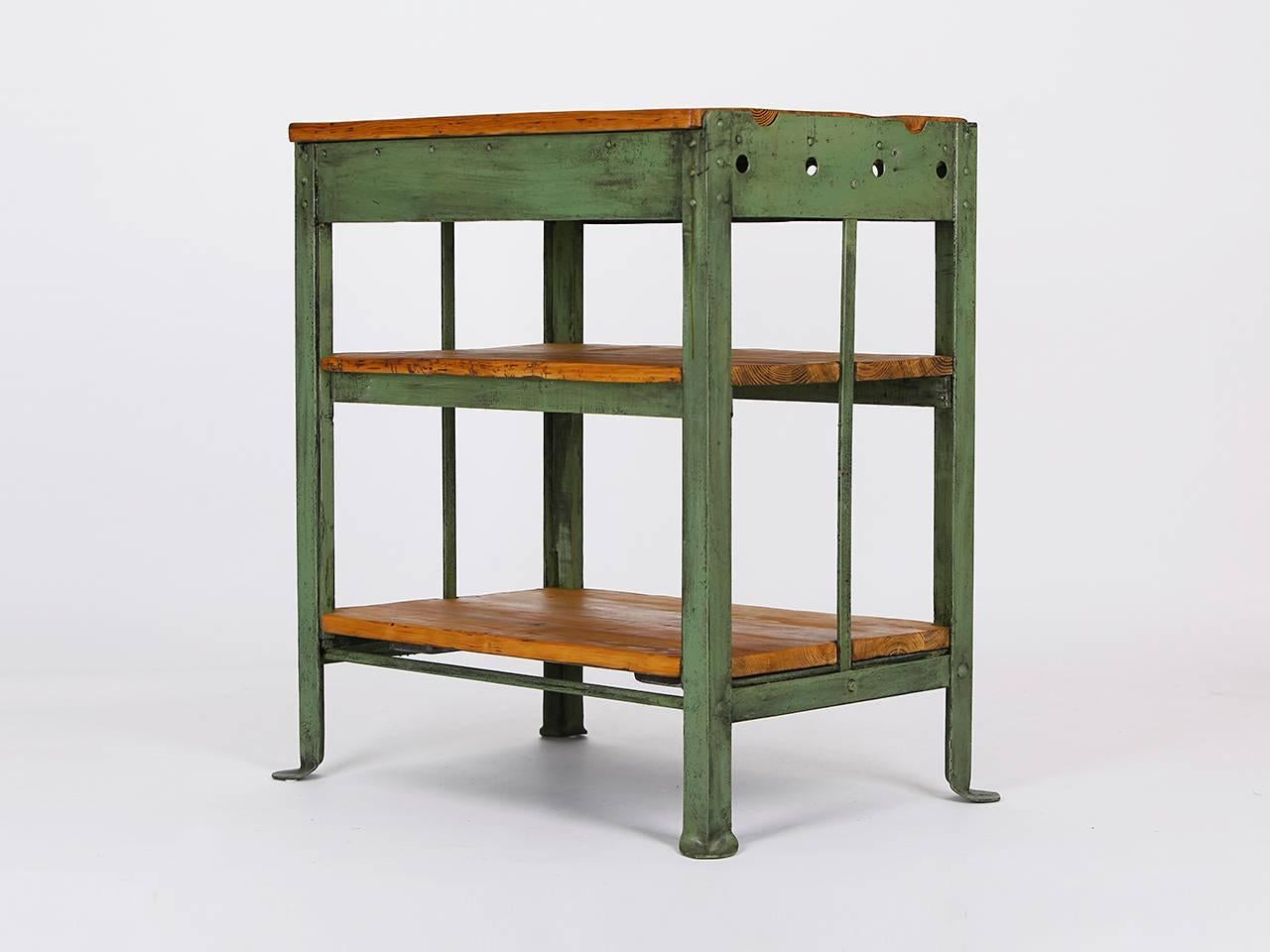 Workbench from a Czech factory. Made in the 1940s. The iron frame was cleaned. The wood panels have been restored.
 