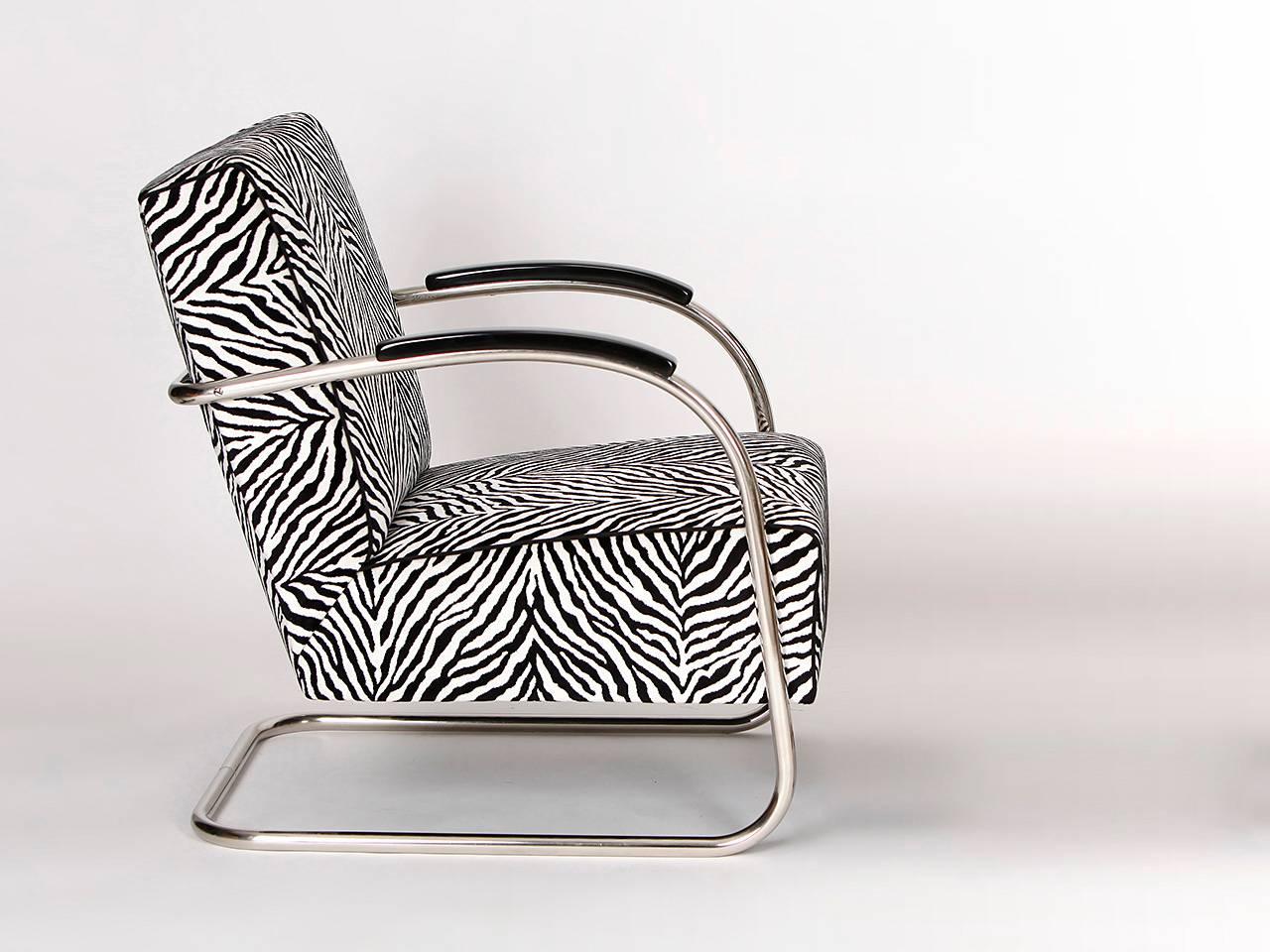 Armchairs with tubular steel frames from the 1930s. Manufactured by Mücke & Melder, Frystat in former Czechoslovakia. Completely restored with new springs. Armrests have a black lacquered finish. Reupholstered in Zebra print by English fabric