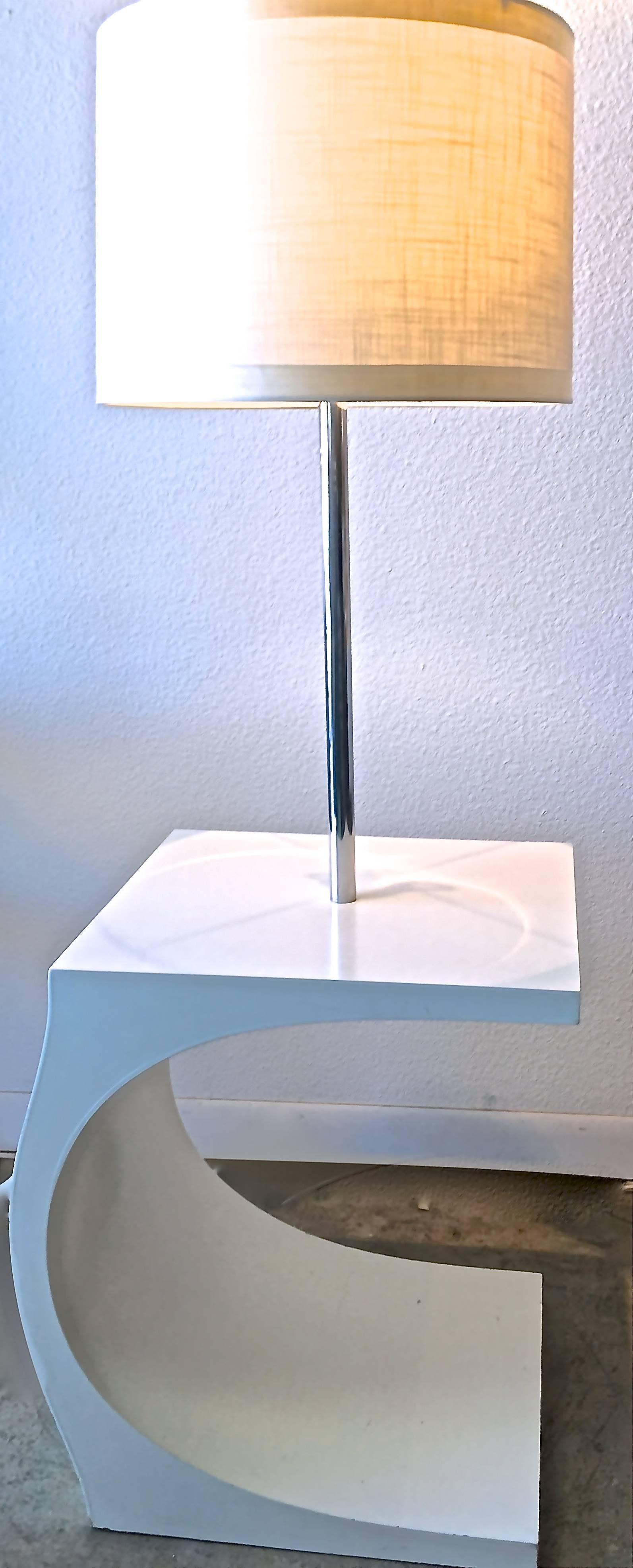 Thoroughly modern Modeline cantilevered c-shaped lamp table from the early 1970s. White lacquered wood base with chrome pole and crisp, textured new white shade. Sleek, groovy, whimsical.