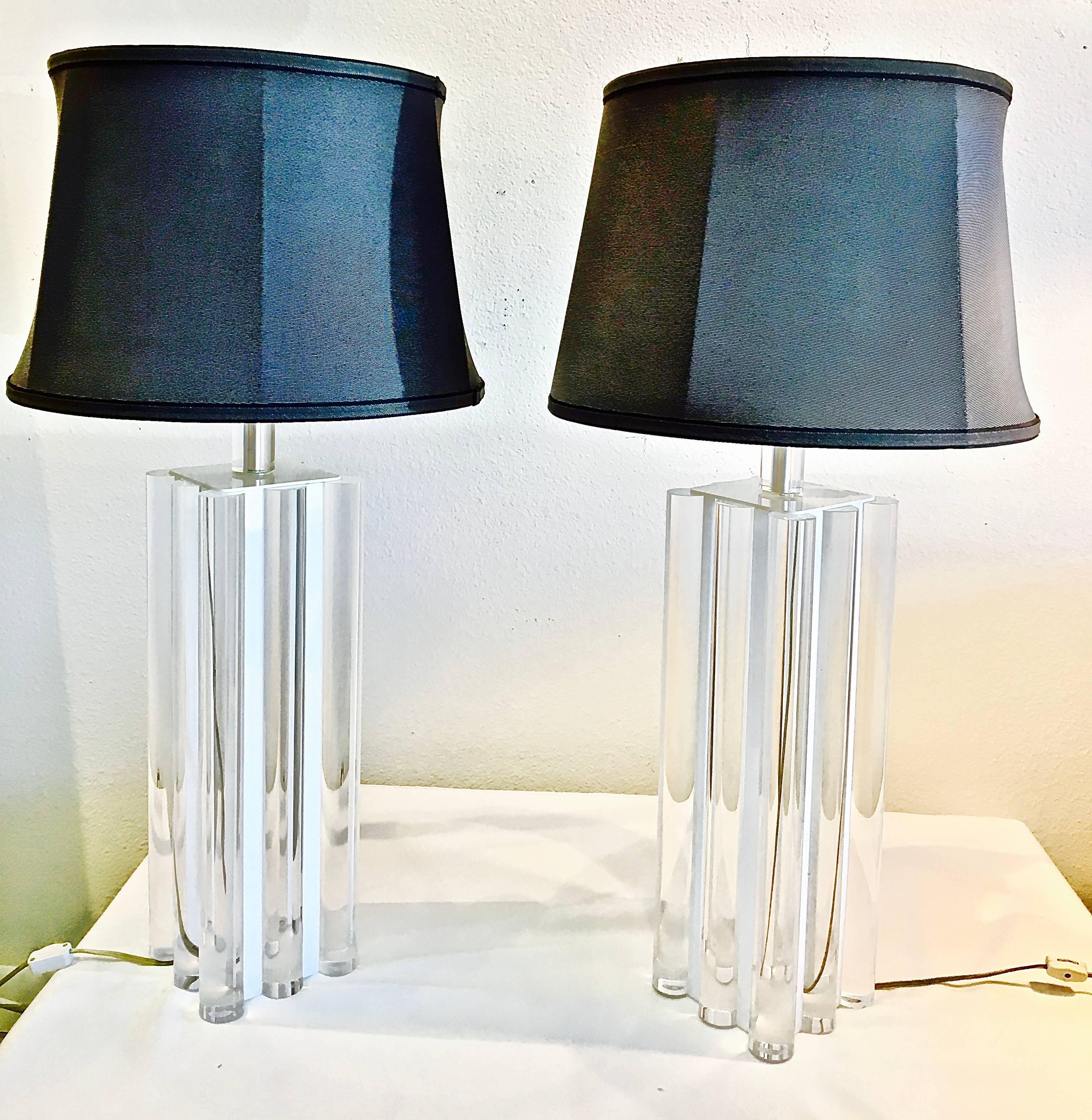 Exquisite pair of Charles Hollis Jones column lamps in clear Lucite with white Lucite accents, circa 1970s. Lamps have been vetted personally by Charles Hollis Jones as his design.