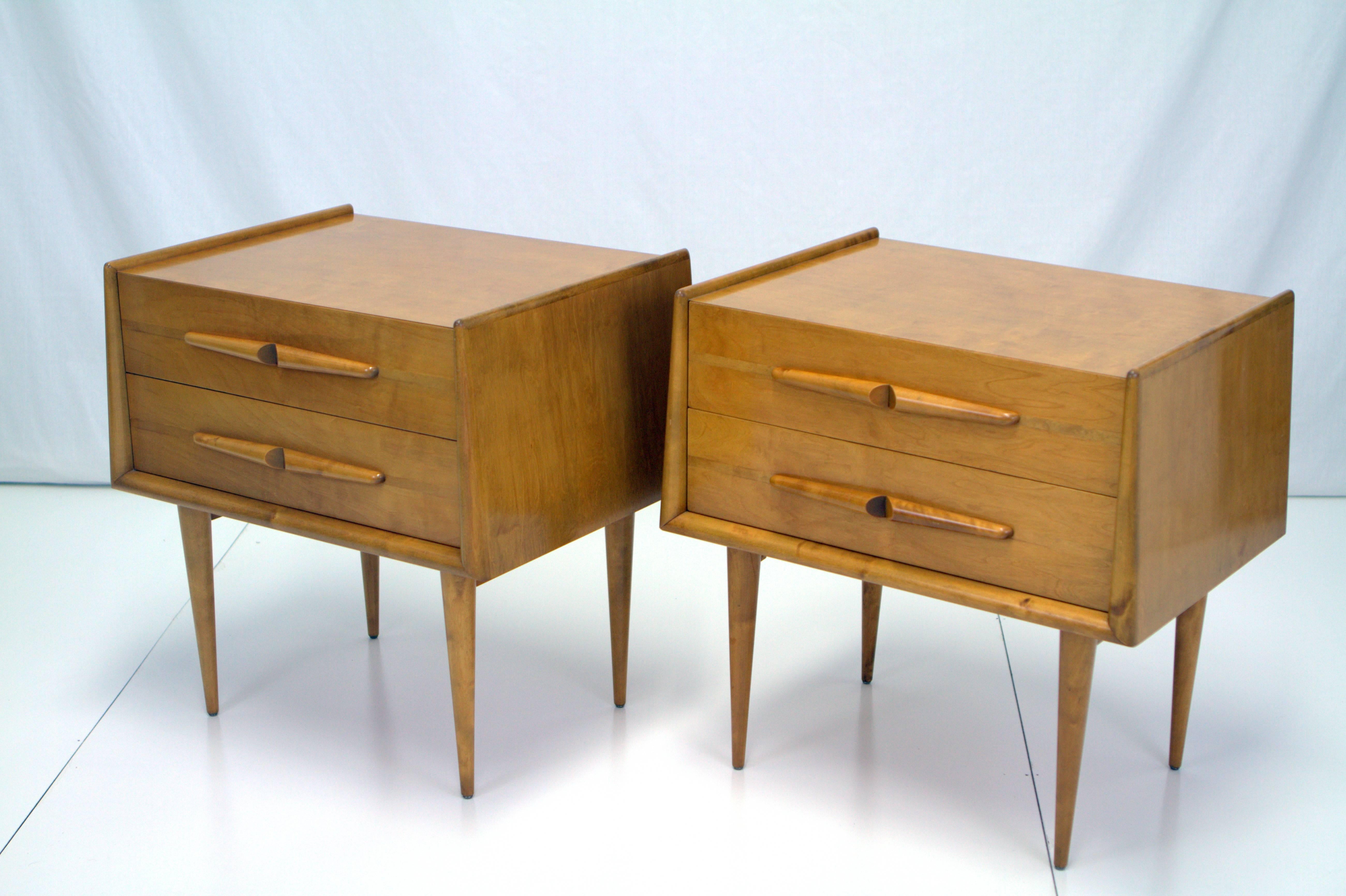 Edmund Spence pair of birch nightstands with sculptural pulls. Superior construction details like Maple wood bands along pulls and inside mitered top drawer to create seamless finish set these apart. Rounded edges taper up while resting on thin and
