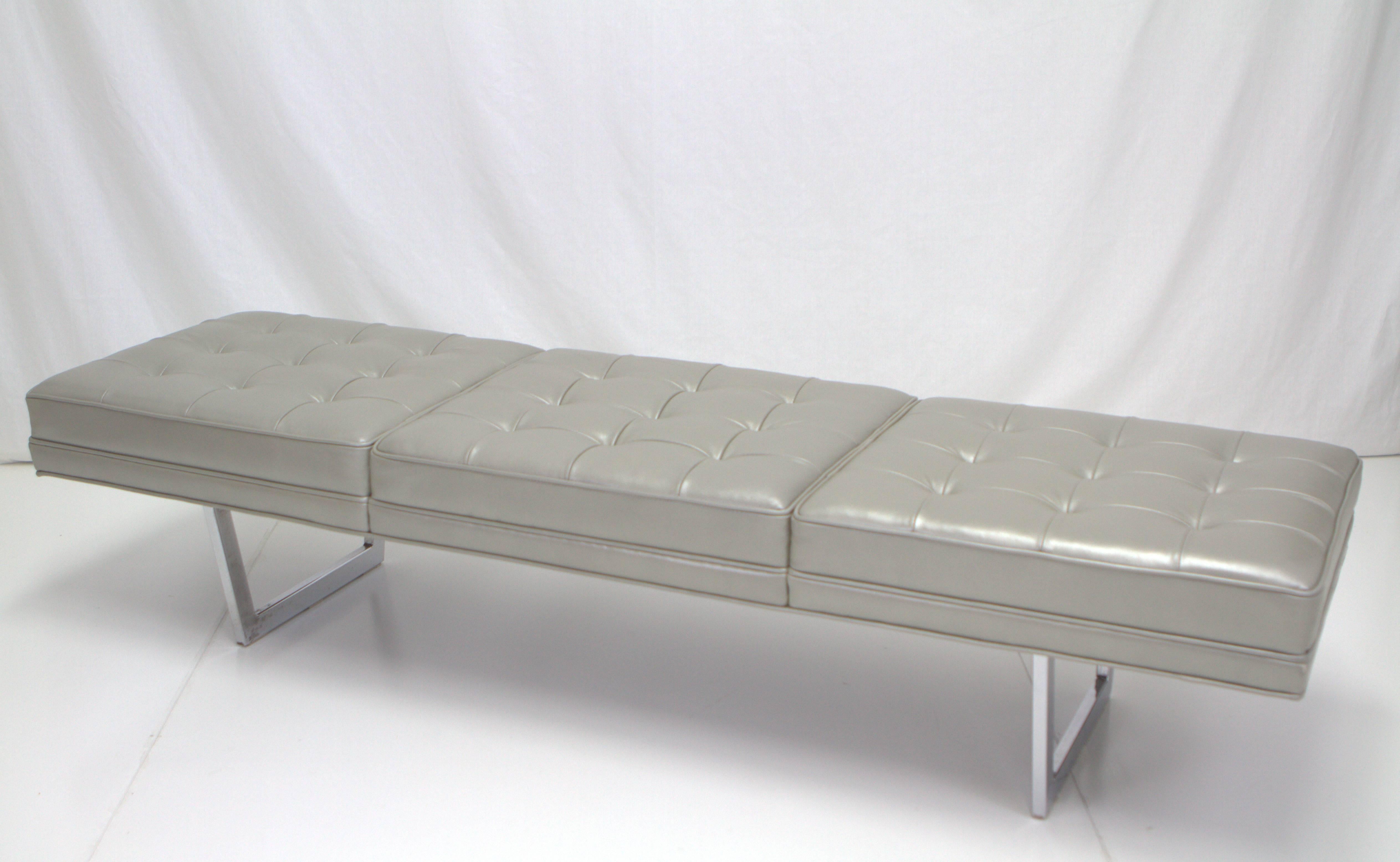 Fascinating metallic silver leather upholstered bench consisting of three biscuit tufted sections on chrome base. Base reminiscent of George Nelson while top upholstered in Florence Knoll style. Newly upholstered with chrome base in original