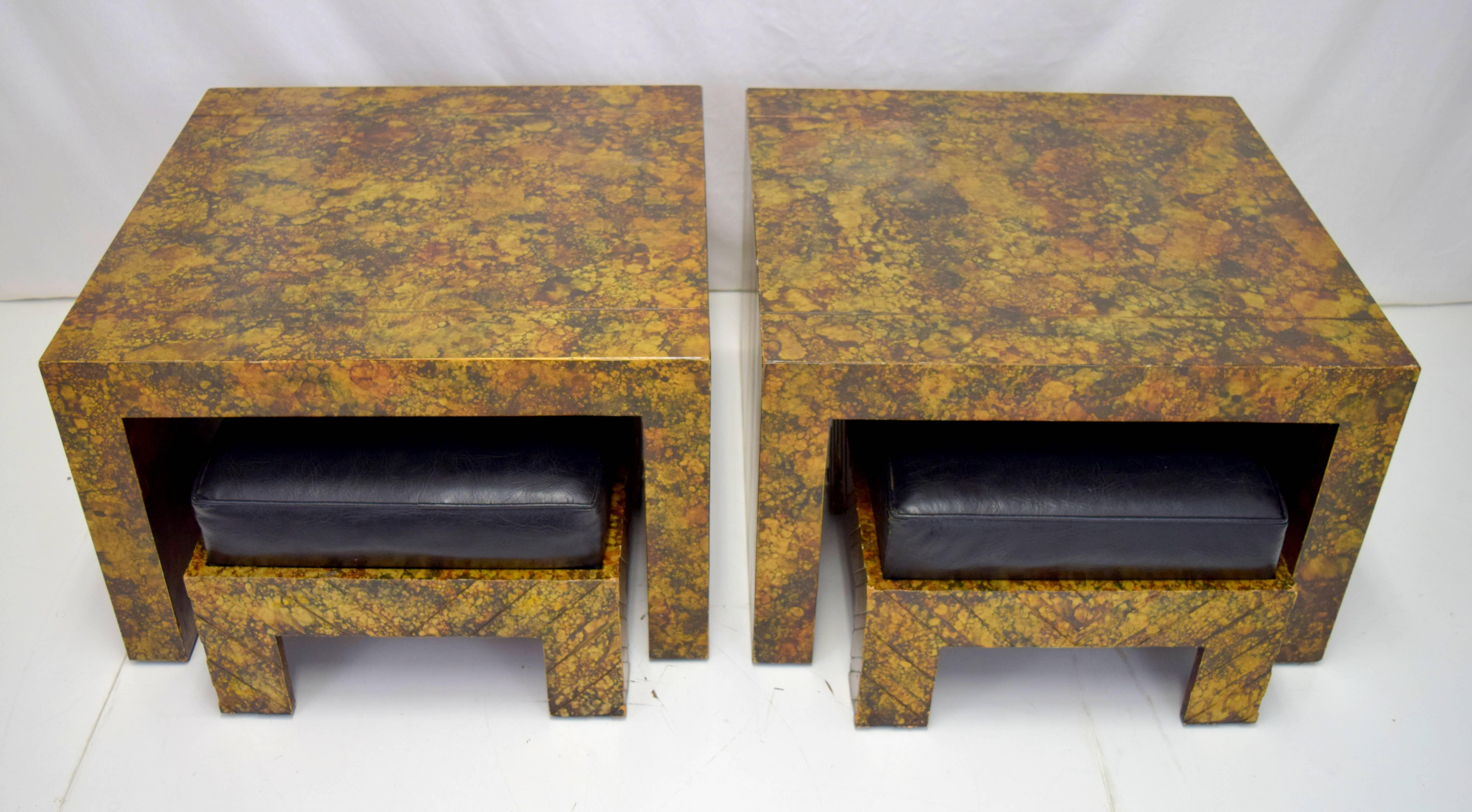 Elegant pair of Hollywood Regency end tables by Phyllis Morris with nesting ottomans. Retains original oil drop or faux tortoise shell finish. Ottomans have removable vinyl pads and chevron incised pattern. All pieces with signed Phyllis Morris.