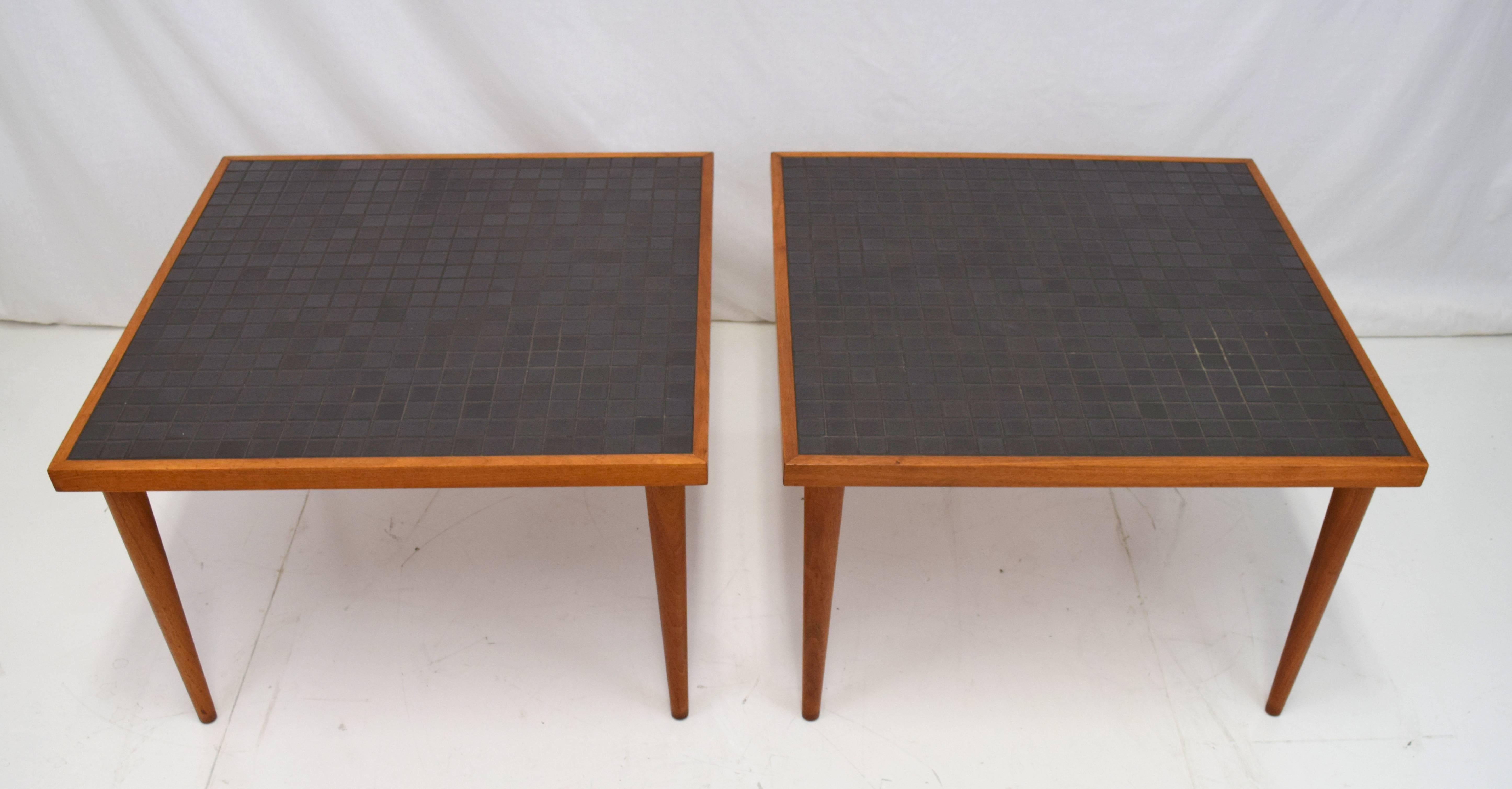 Simple yet elegant pair of Martz tile end tables for Marshall Studios. Walnut frame with tall conical legs and dark charcoal toned tile top. Tiles 1 1/4