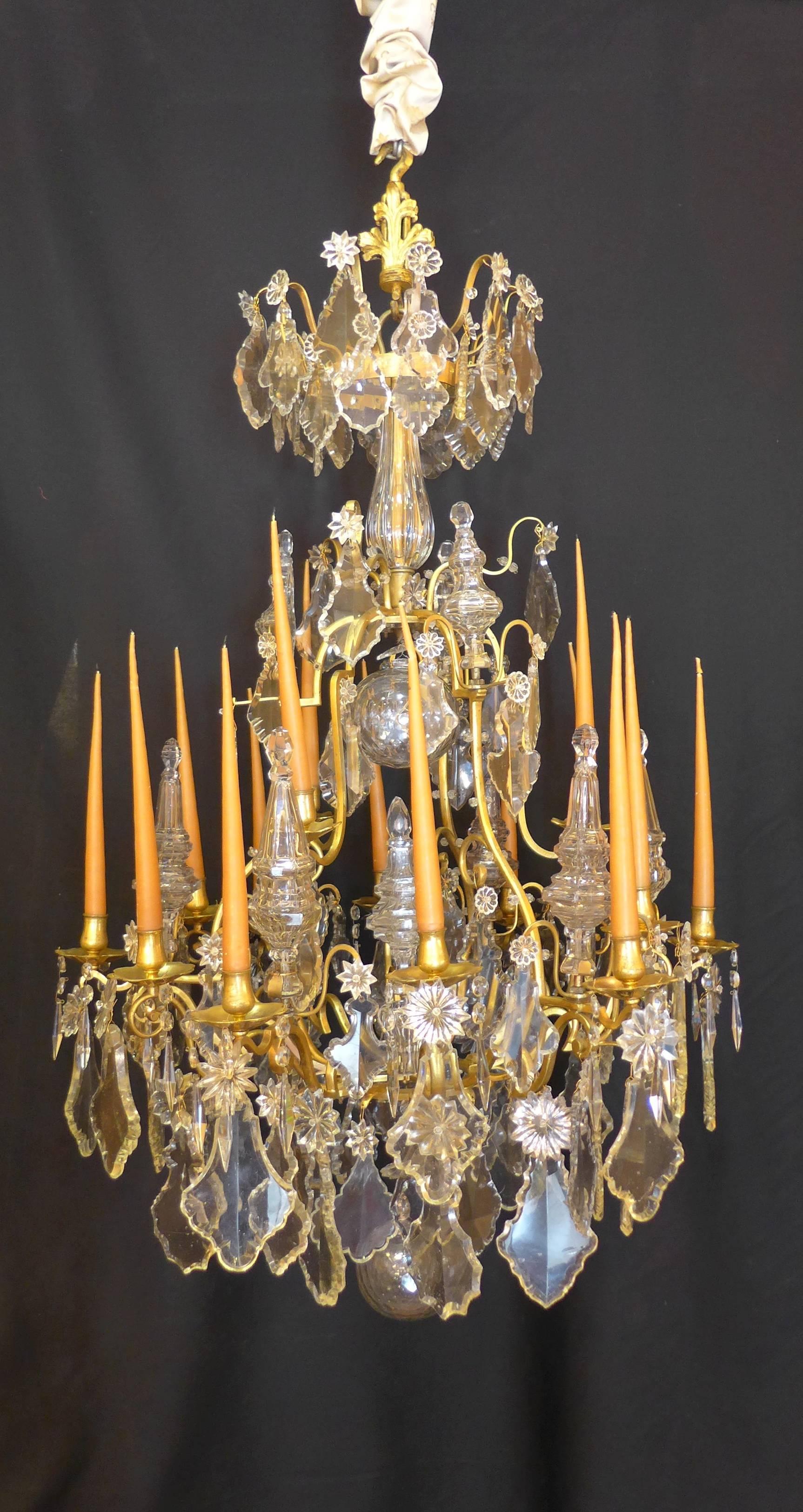 A sensational and extremely rare, unique high quality French mid-18th century, in a classical Louis XV period, ormolu and hand-cut crystal, form cage chandelier.
Our chandelier is composed of fifteen elegantly scrolled arm lights and fourteen