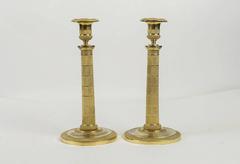 Early 19th Century Pair of French Empire Period Ormolu Candlesticks, circa 1810