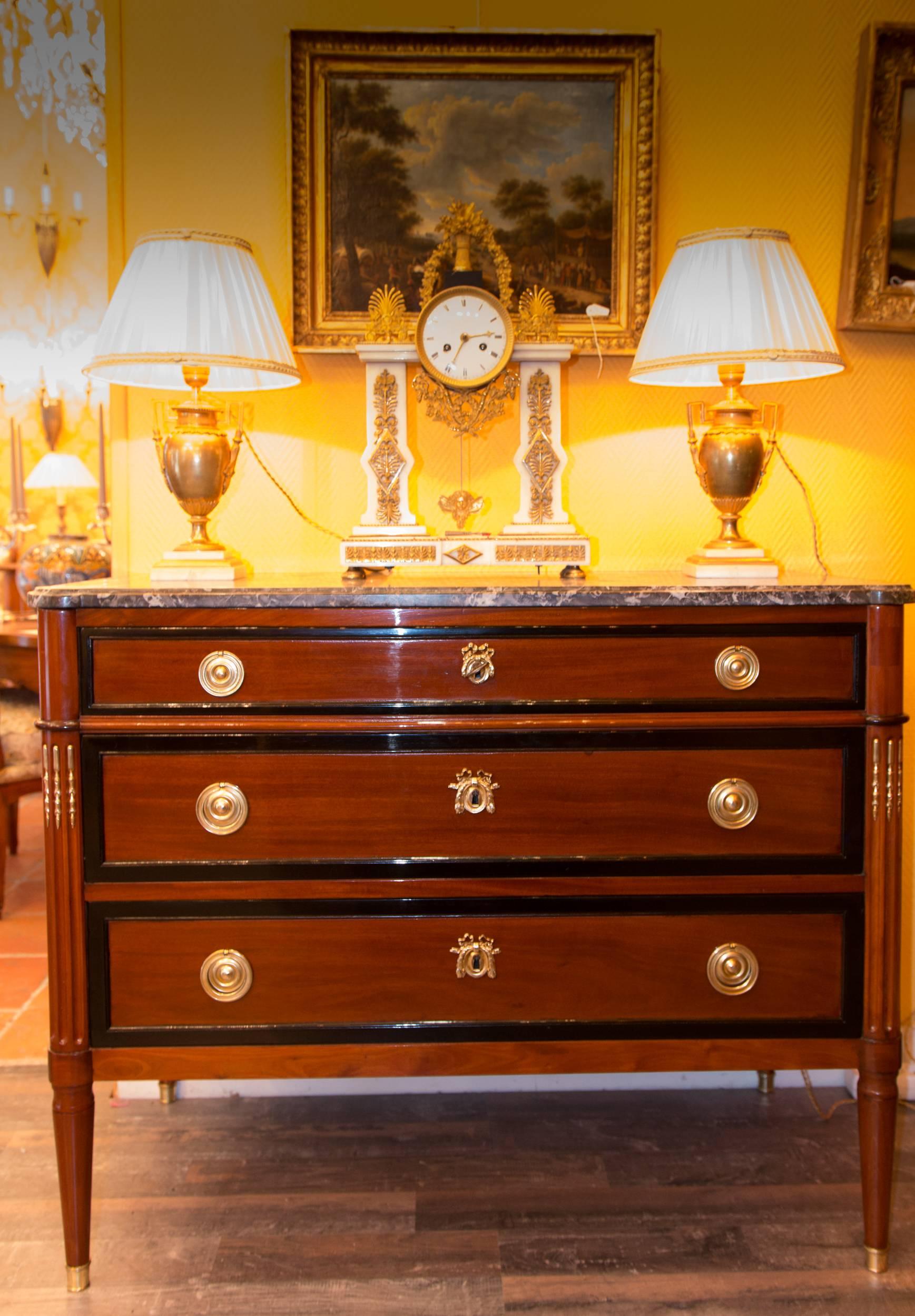Lovely and fine quality, mahogany and ebonized mahogany commode with a “Sainte Anne Grey” marble top. Our commode opened by three drawers. Original chiseled ormolu hardware. 

Very interesting and ornemental French Louis XVI period, late 18h