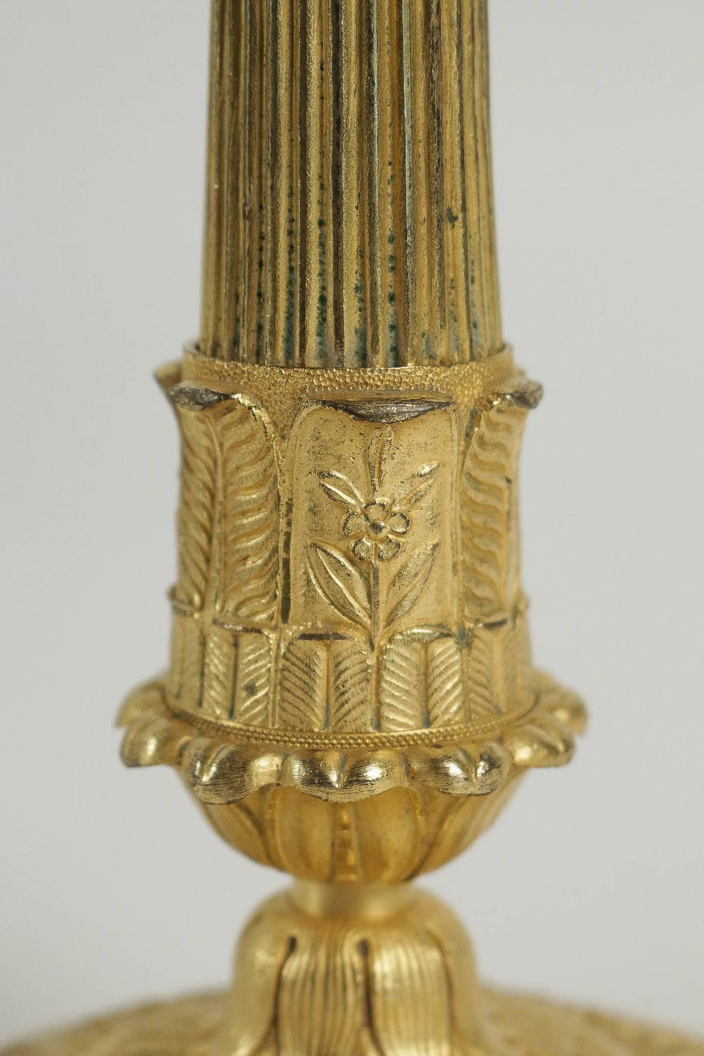 Bronze French Empire Period, Pair of Chiseled Ormolu Candlesticks, circa 1810