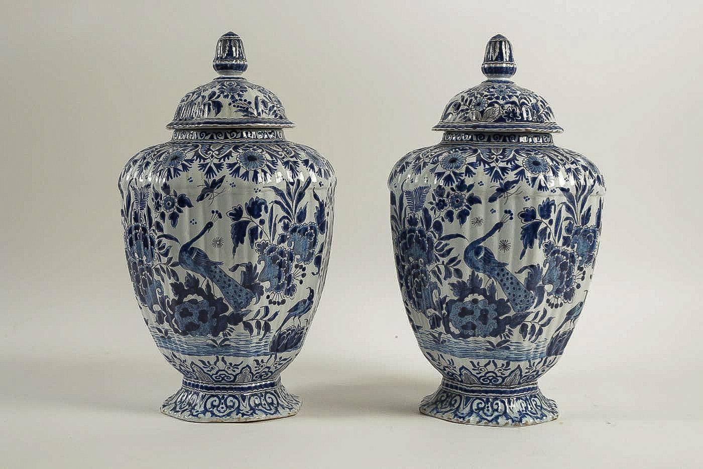 We are pleased to present you, Netherlands, exciting and decorative pair of early 19th century Delft vases, signed with a blue monogram. 

Excellent condition.

Dimensions: Height 14.96 inches, diameter 9.44 inches.