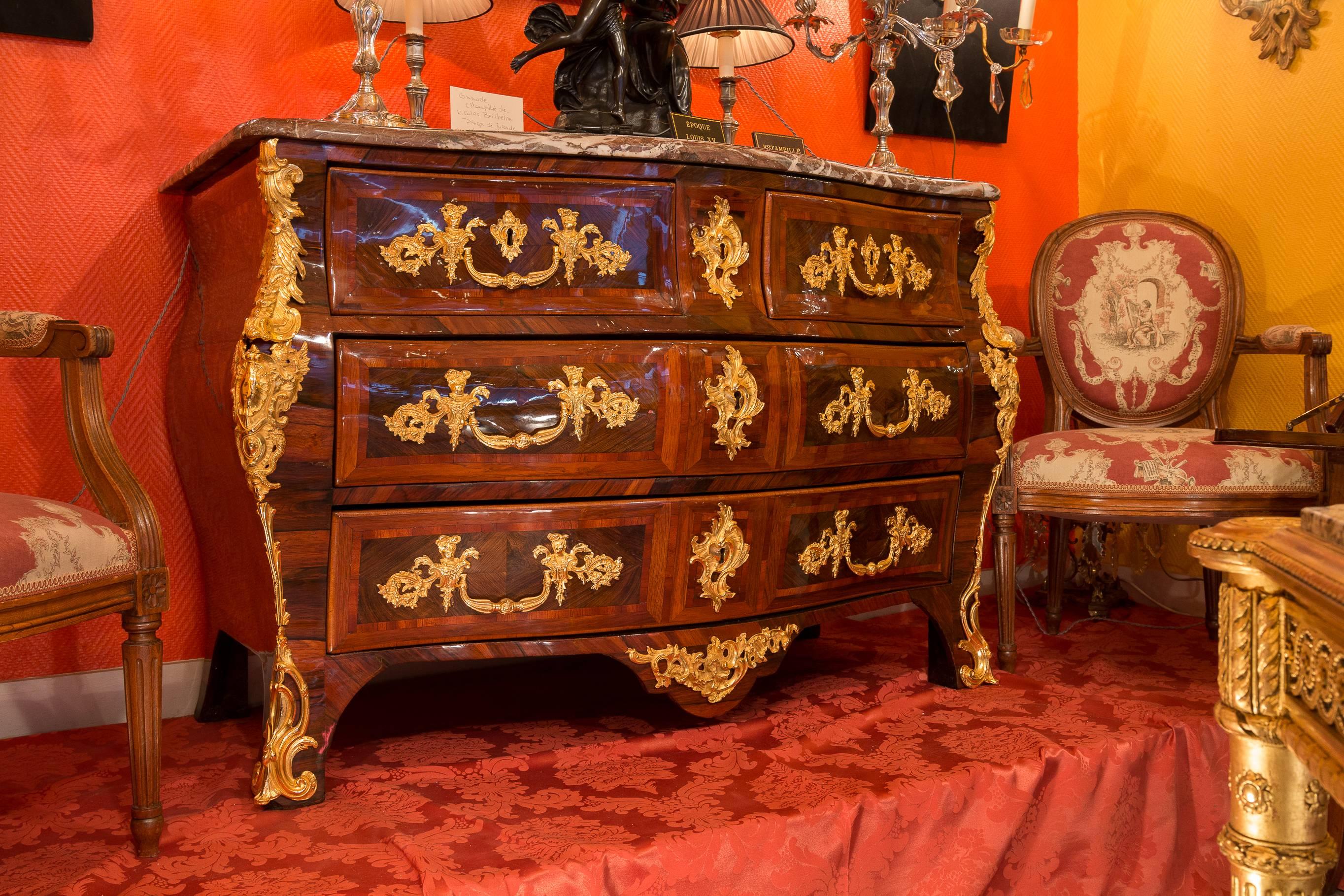 We are pleased to present you a fantastic, beautiful, elegant and rare French Louis XV period marble top commode with four-drawer serpentine and bombe chest with multi-wood inlay and magnificent gilt bronze mounts.
Maker monogram stamp and JME on