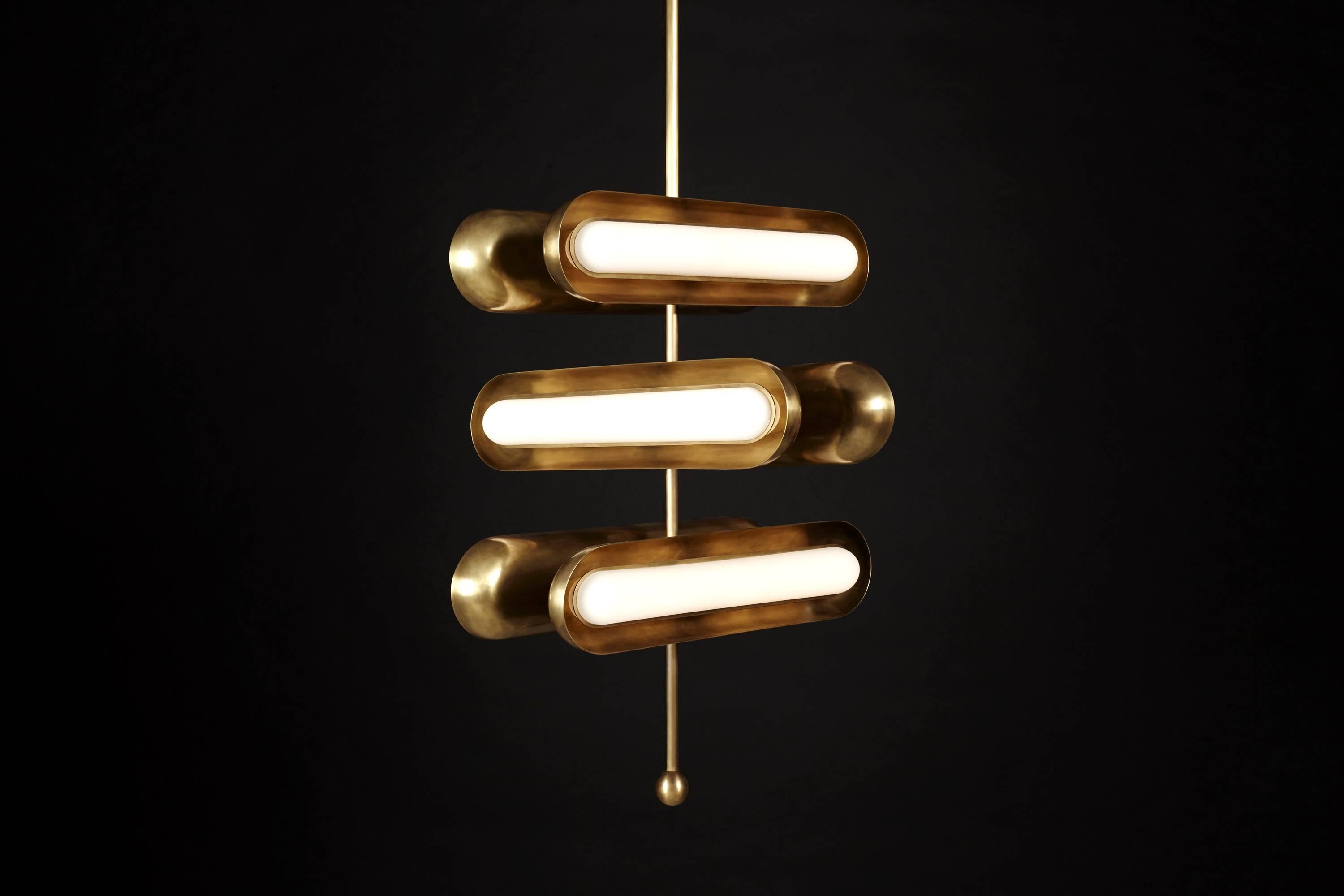 The Circuit series creates rhythm with the repetition of pure shapes. A glowing glass capsule nests in a brass shade, becoming a contained form that multiplies to construct larger fixtures.

The Circuit 6 stacked uses a specially developed, warm LED