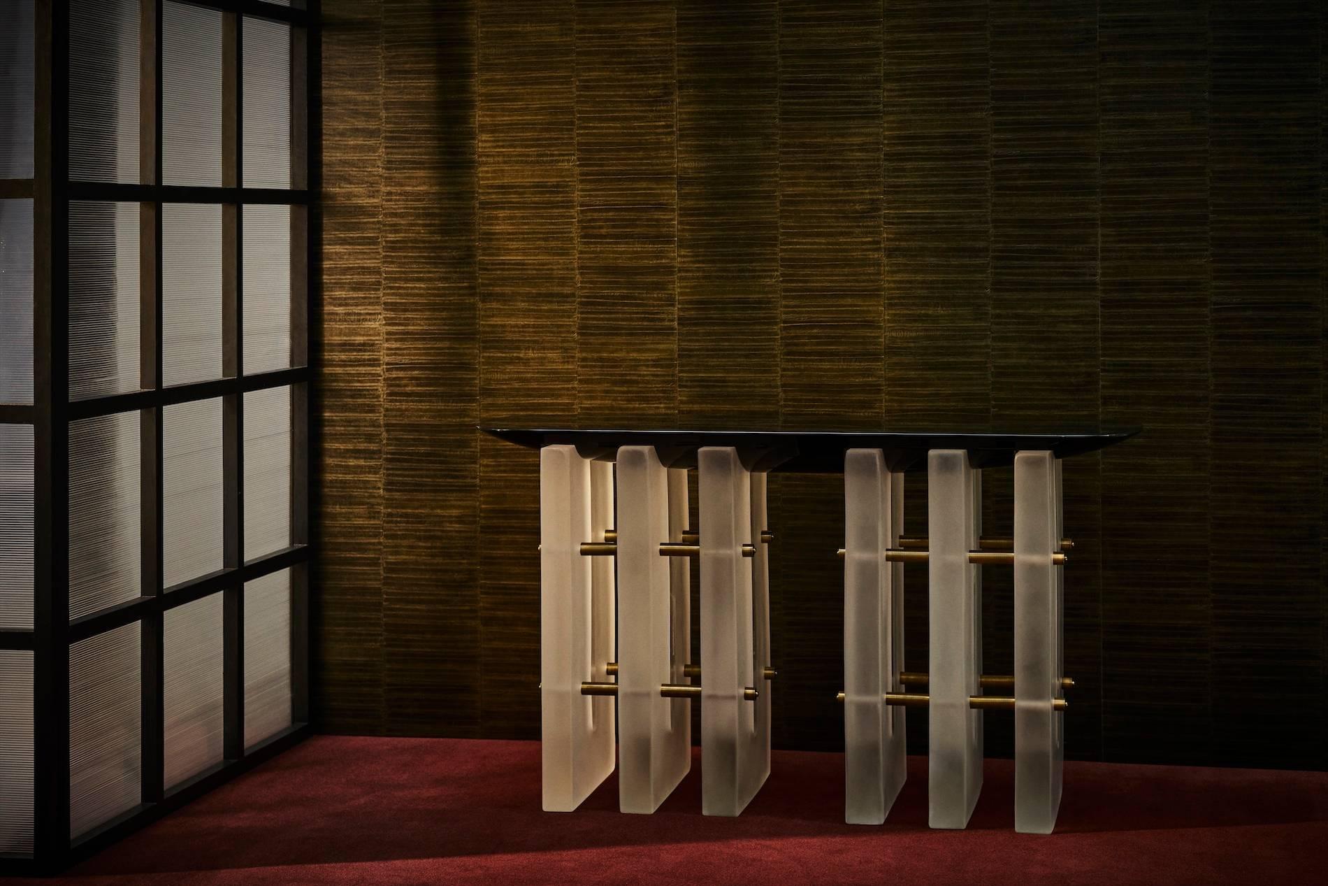 The translucent resin bases of the Segment series lift softly-rounded forms, creating avisual play between density and lightness. The underside of the lacquer table tops bulge as though being pulled back to the floor, anchoring one form to the other