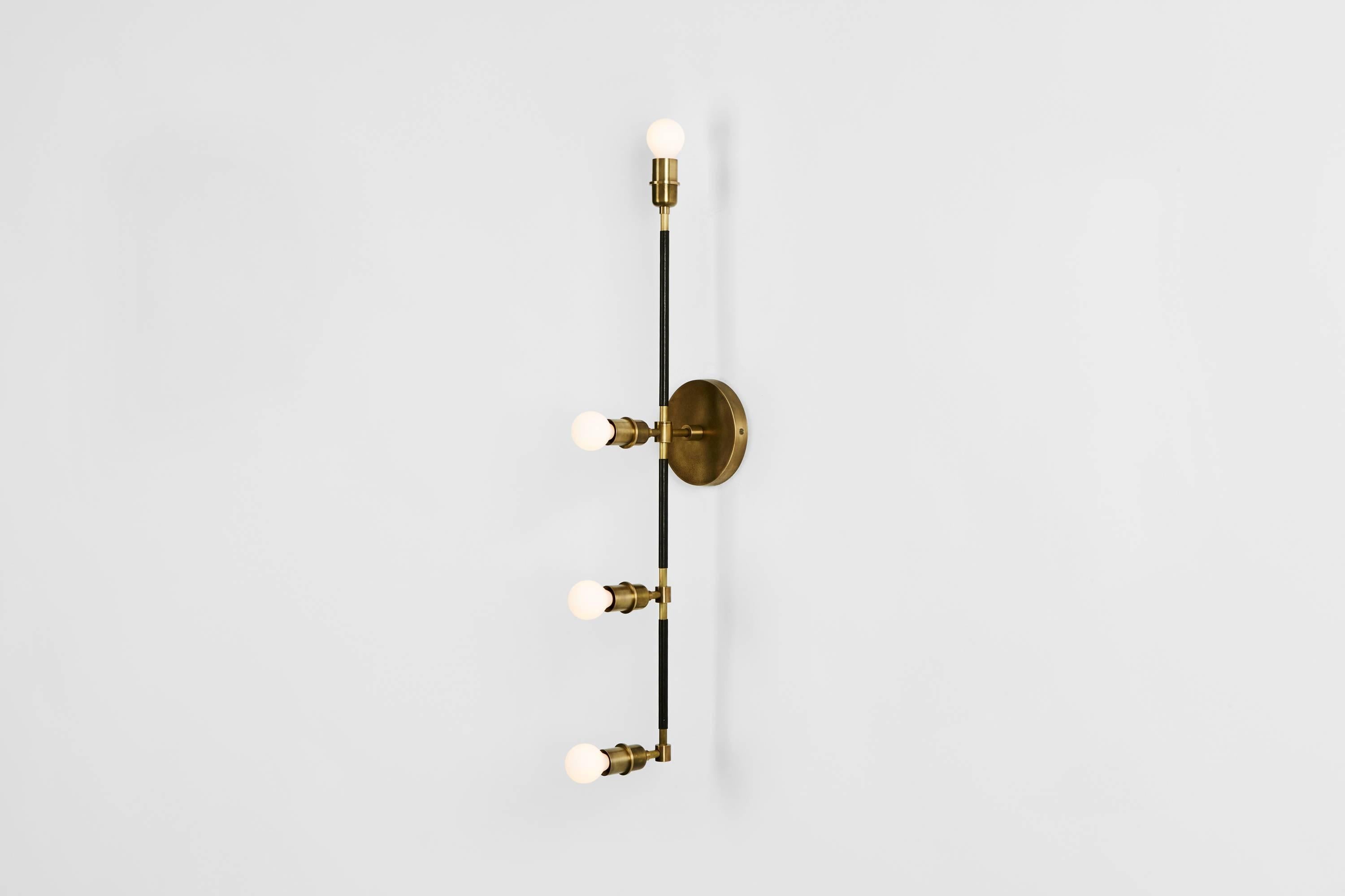 A modern interpretation of classic dressing room lights. Hang them flanking a mirror for flattering, warm light. 

Made to order and finished and assembled by hand in New York City. Allow 8 to 10 weeks for production. Customization available.