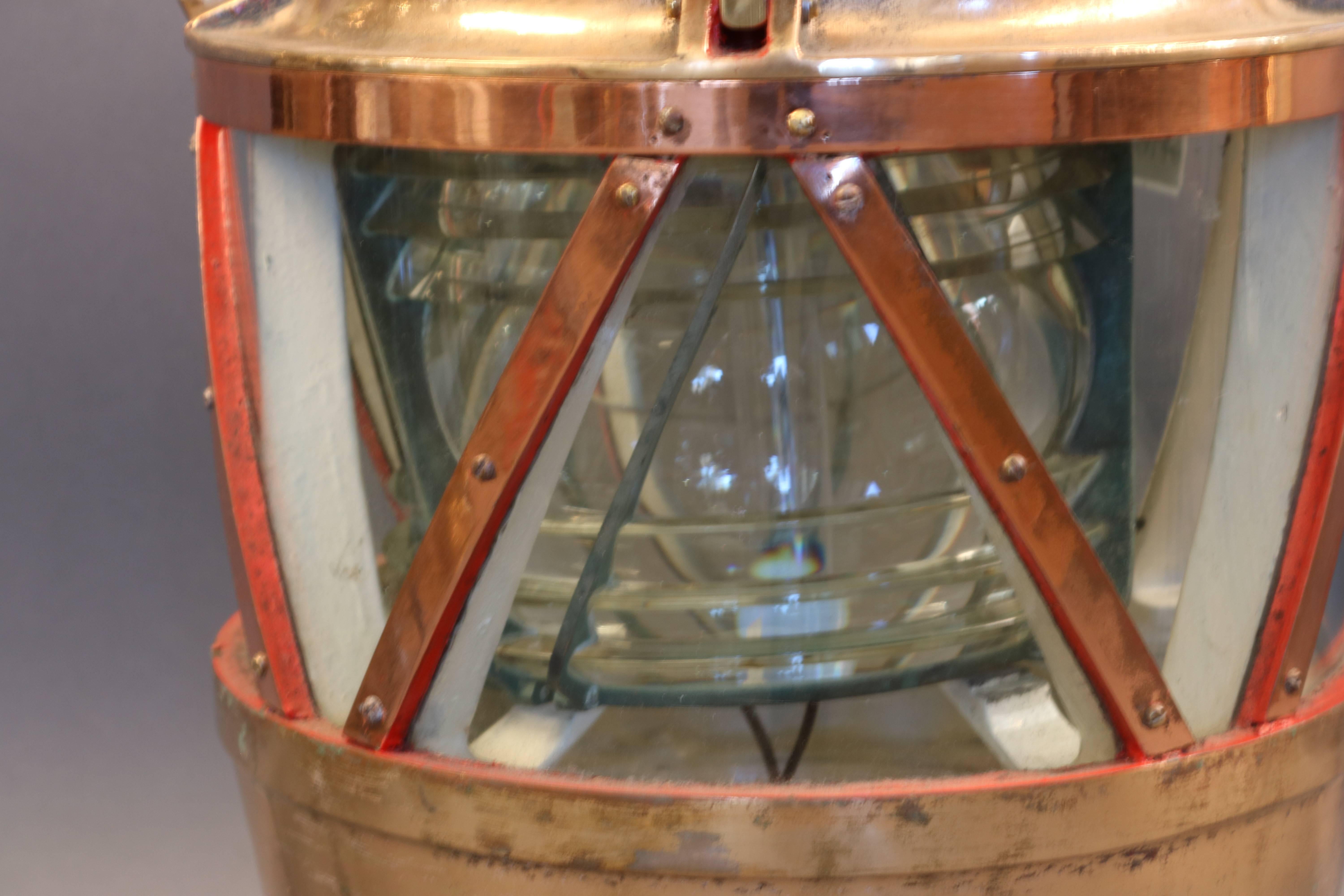 Solid copper and brass maritime beacon. Choice nautical relic with fresnel glass lens. Converted to electricity.