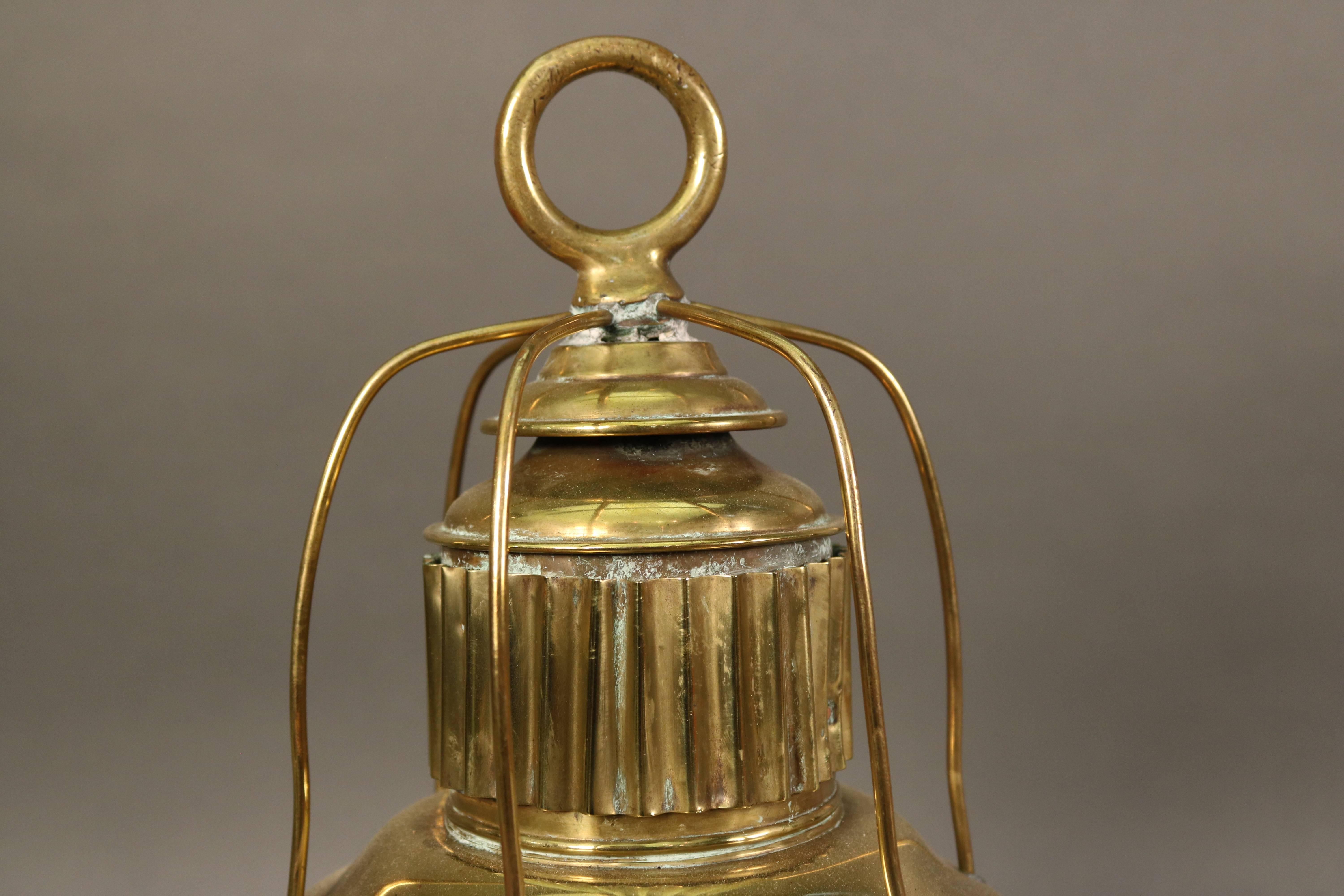 19th century ship's lantern with cobalt blue Fresnel lens, vented top, hoisting ring, protective bars, tether rings etc.. Fitted with an a/c socket.
