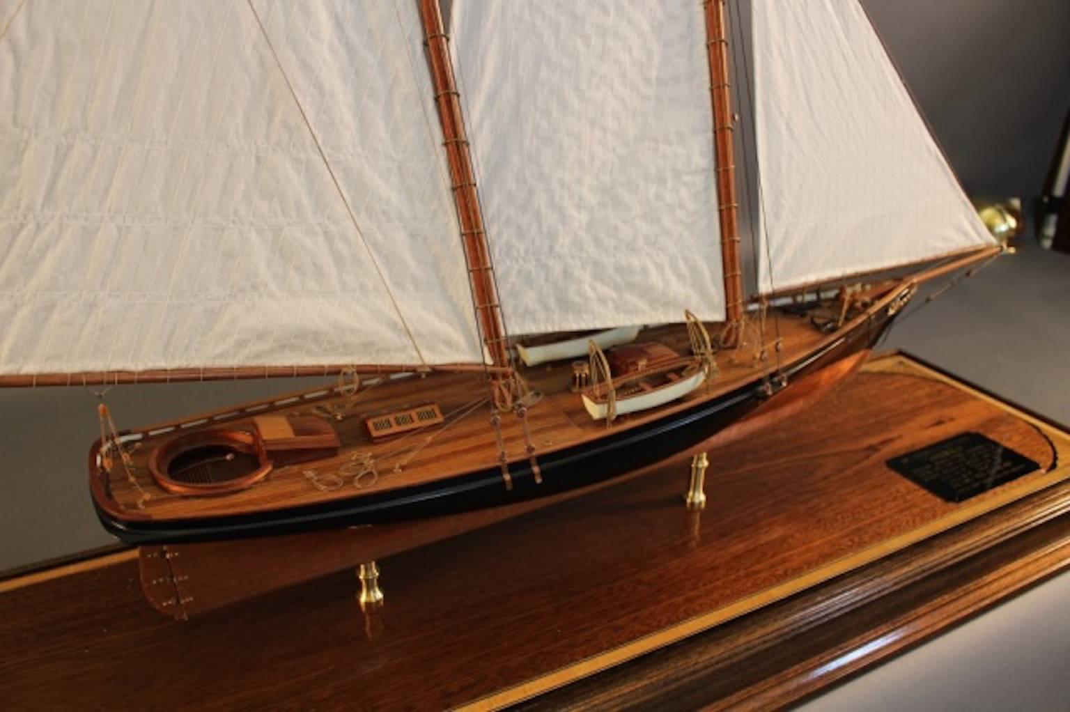 Fine, scale model of the schooner yacht “America”, the first winner of the America’s Cup. Copper sheathed below the waterline. Mahogany deck, linen sails. Mounted into a brass display case.
Model dimensions: 35" L x 6" W x 29"