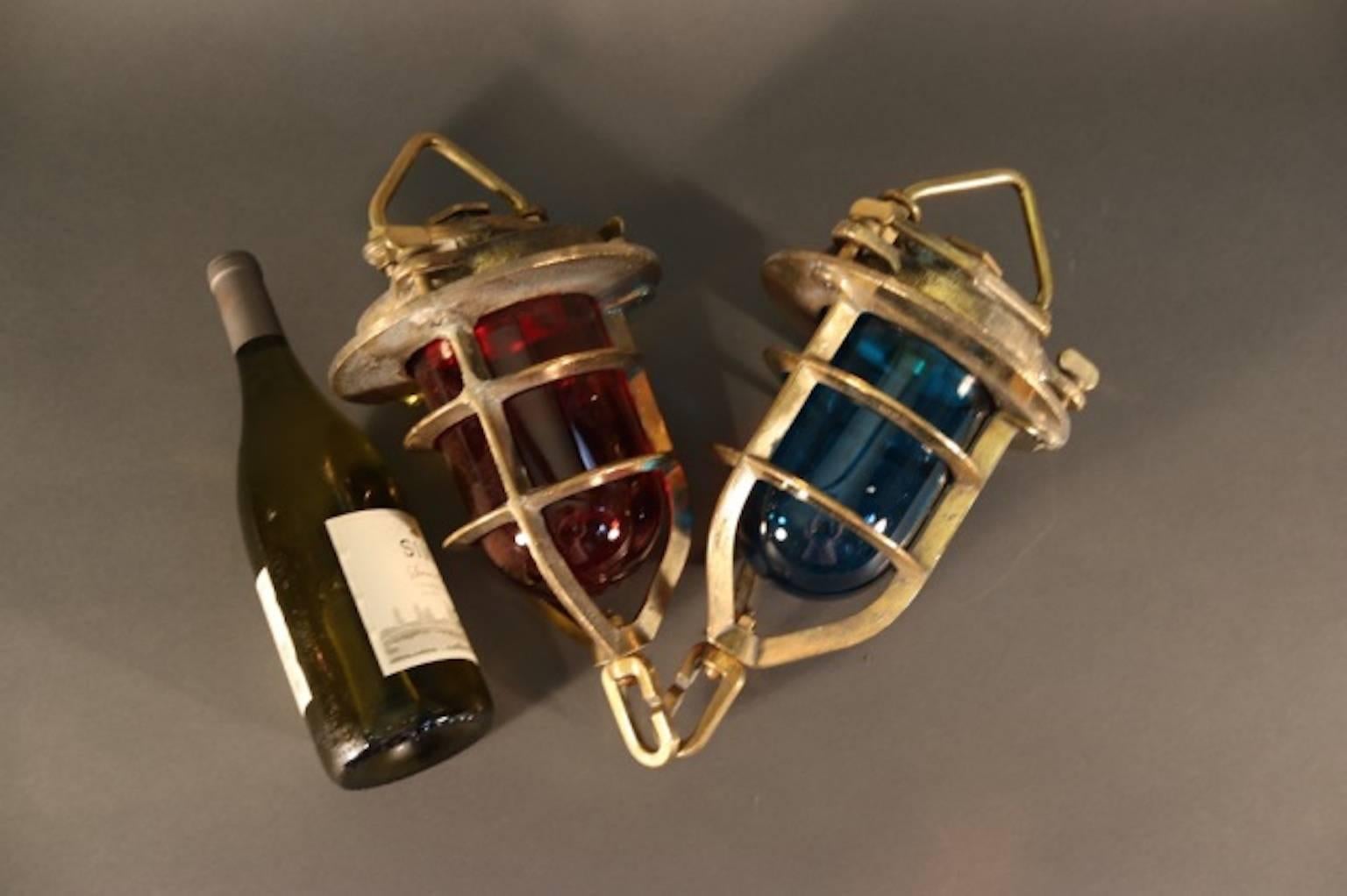 Original marine convoy lights from a ship of the English Royal Navy. Signalling light with red and blue lenses, protective cages, hoisting brackets and tether ring.
Dimensions: 8" L x 13" H.
Weight: 16lbs (pair).
