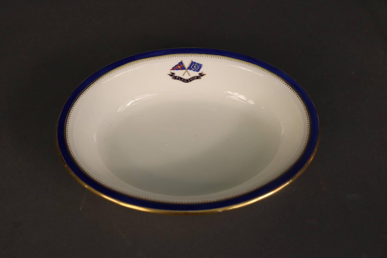 Personal dinnerware made exclusively for J. Pierpont Morgan (1837-1913) for use aboard his Flagship Corsair, built in 1890. This 6” Flagship Corsair vegetable side plate bowl by Minton's has the J. Pierpont Morgan signature navy blue trim with gold