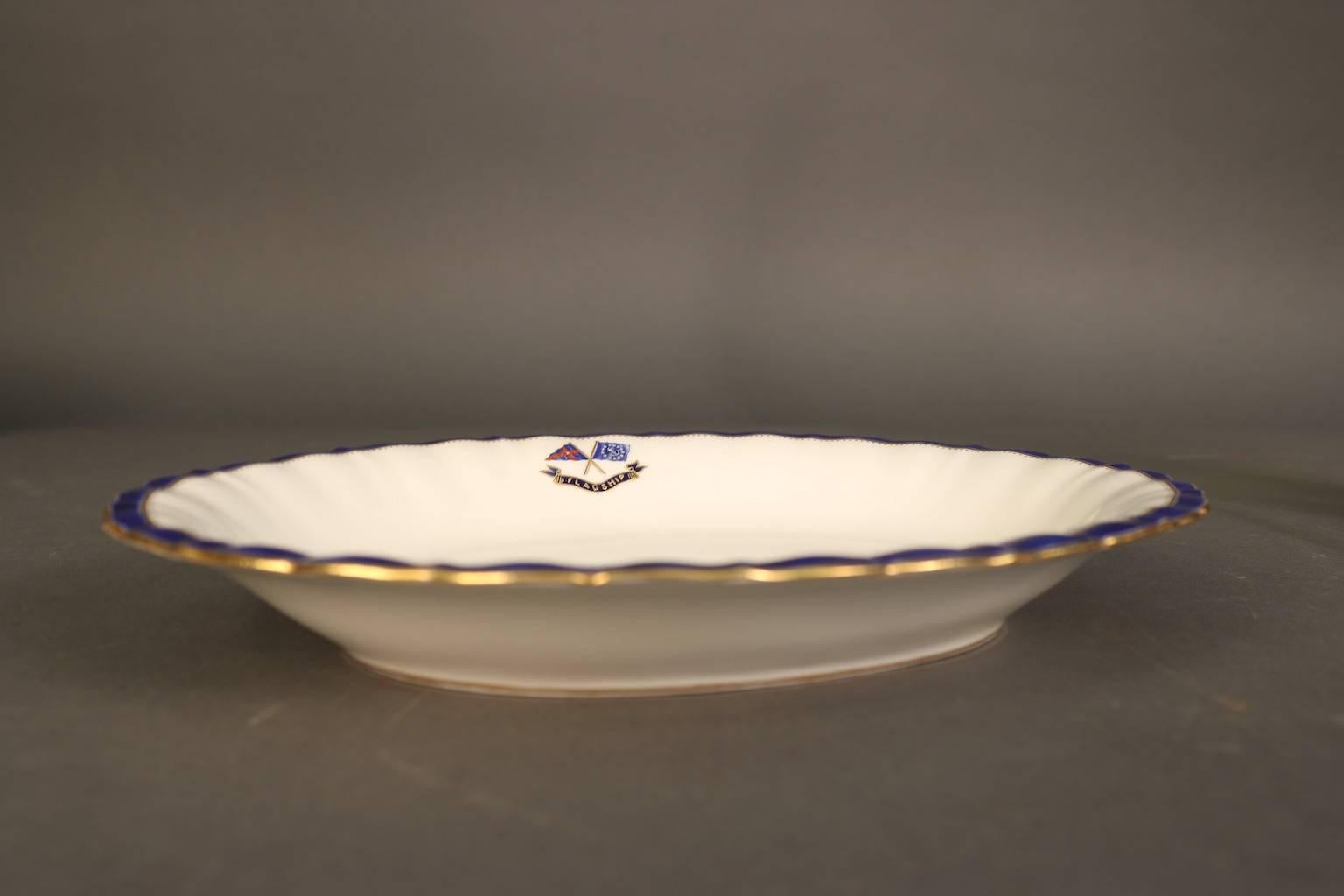Personal dinnerware made exclusively for J. Pierpont Morgan (1837-1913) for use aboard his Flagship Corsair, built in 1890. This scalloped flagship corsair serving platterl by Minton's has the J. Pierpont Morgan signature navy blue trim with gold