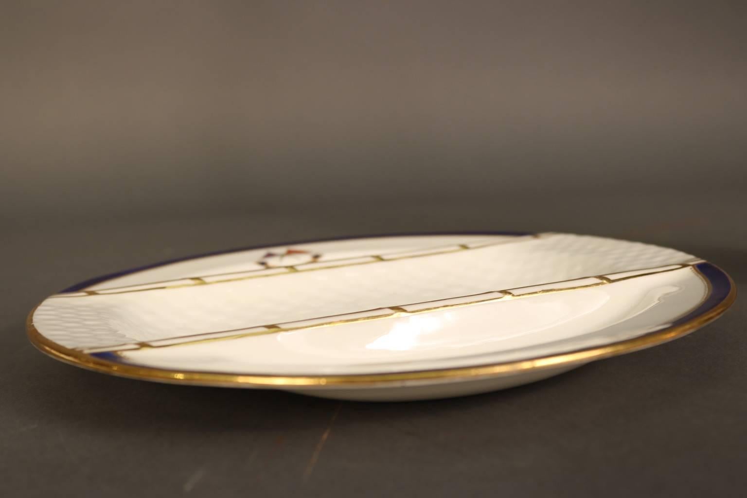 Personal dinnerware made exclusively for J. Pierpont Morgan (1837-1913) for use aboard his personal steam yacht Corsair, built in 1890. This 10” Asparagus Plate by Minton's has the J. Pierpont Morgan signature navy blue trim with gold accents.