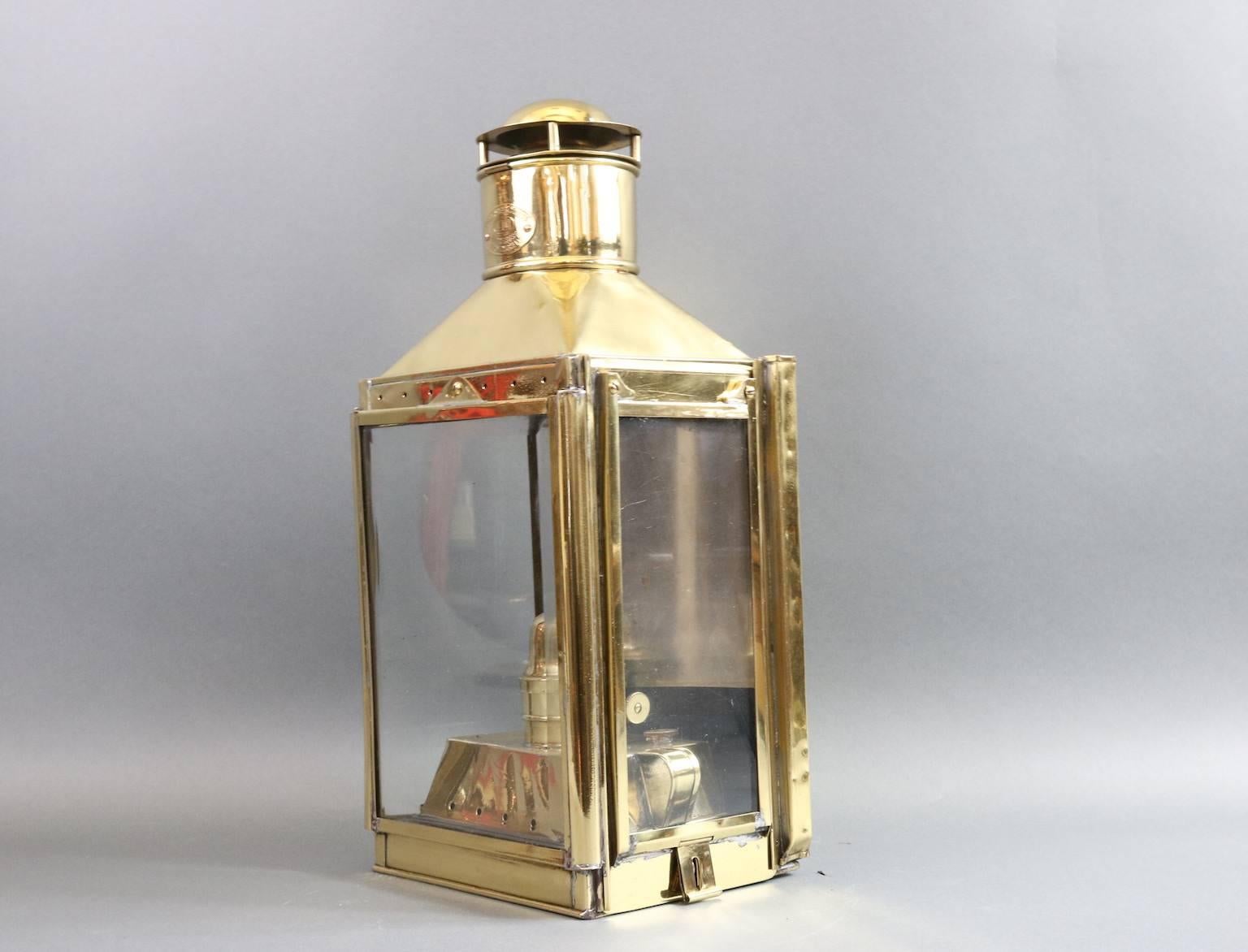 Solid brass ship or yacht cabin lantern by C. Harvie & Co. Limited, 117 Priest Street, Birmingham. With three glass panes, removable burner with tank and vented top. Dimensions: 9.5