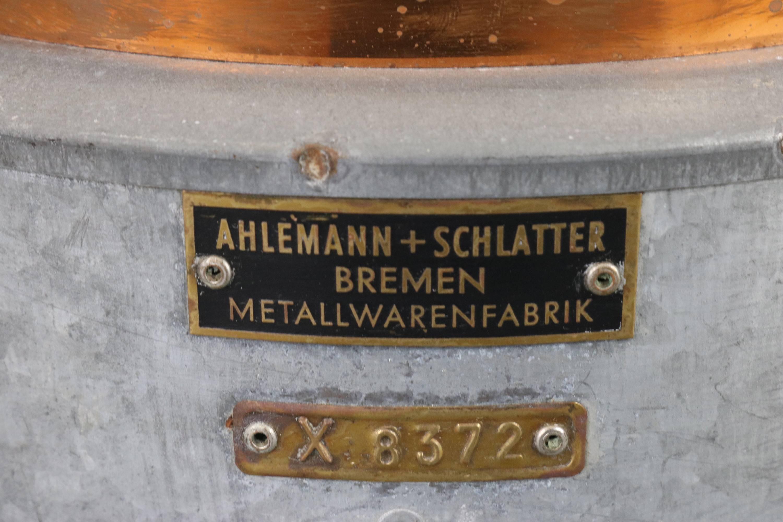 Steel ship's masthead lantern by Ahlemann and Schlatter, Bremen. Copper cap, fresnel lens, vented top, hinged doors. Measures: 21" high x 10" wide x 9" deep.