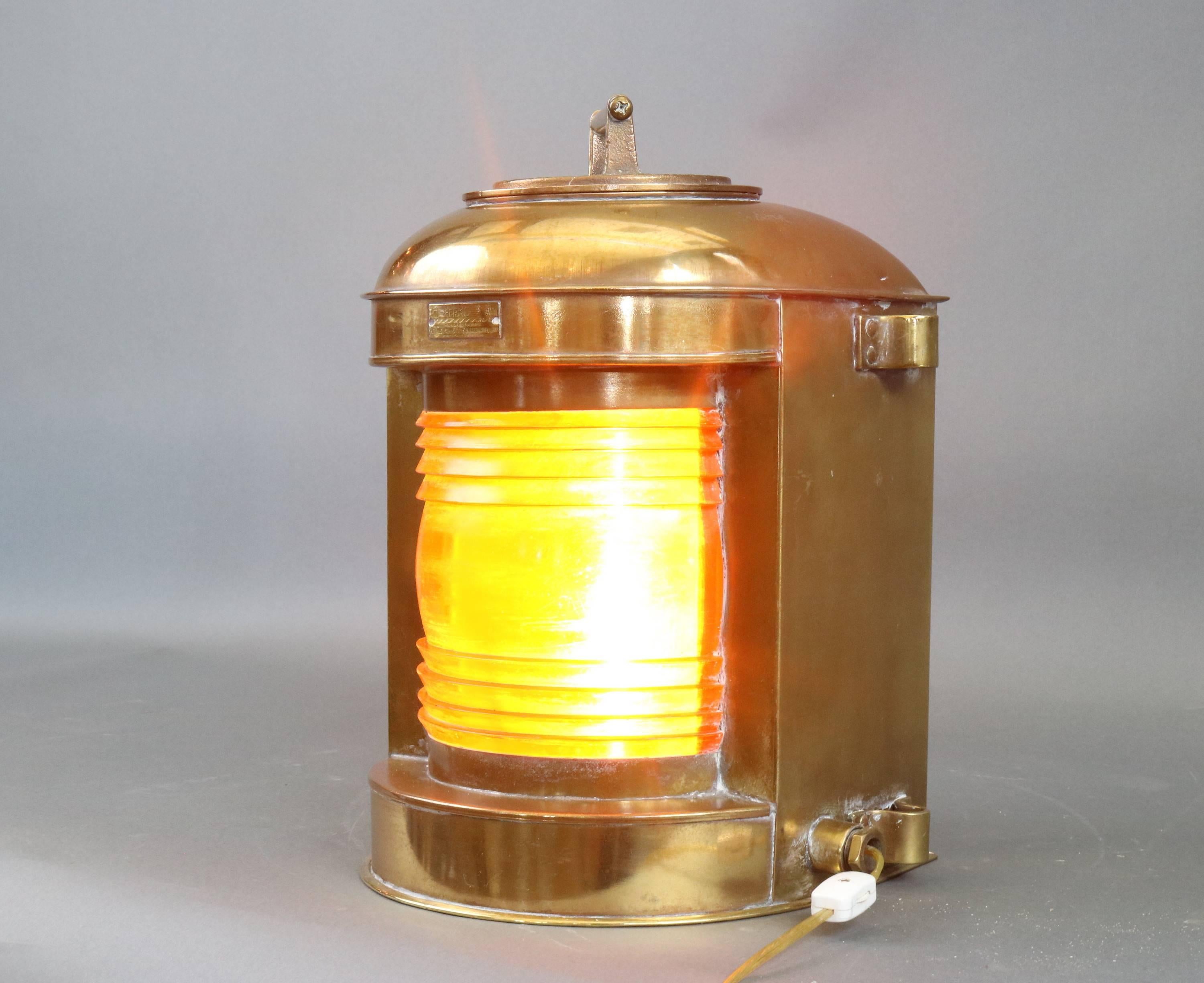 Solid brass masthead lantern by Perko with amber lens, screw top. Electrified. Lens is not glass.