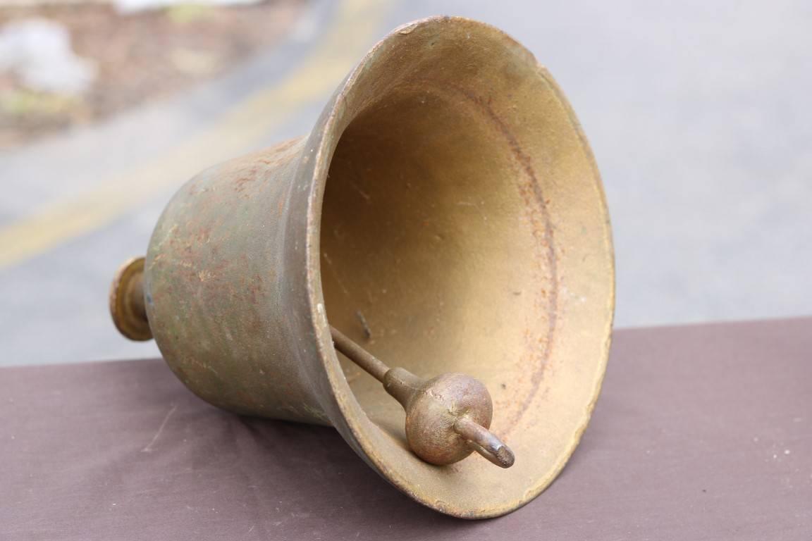 Bronze ship's bell, stamped "US Navy". Dimensions: 9.5" L x 10.5" H.