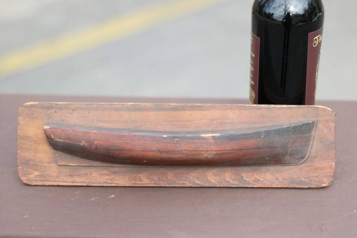 Carved wooden half hull. Dimensions: 14