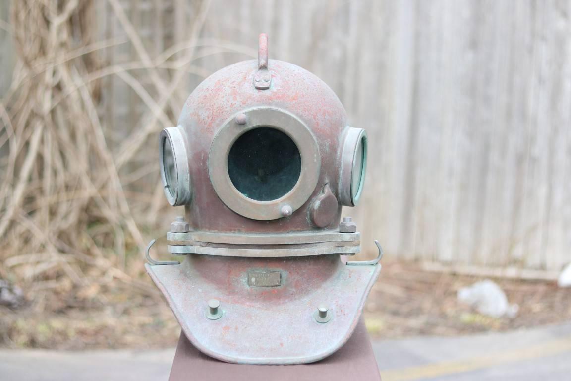 Authentic diver's helmet with breast plate. Dimensions: 15" L x 17" W x 19" H.