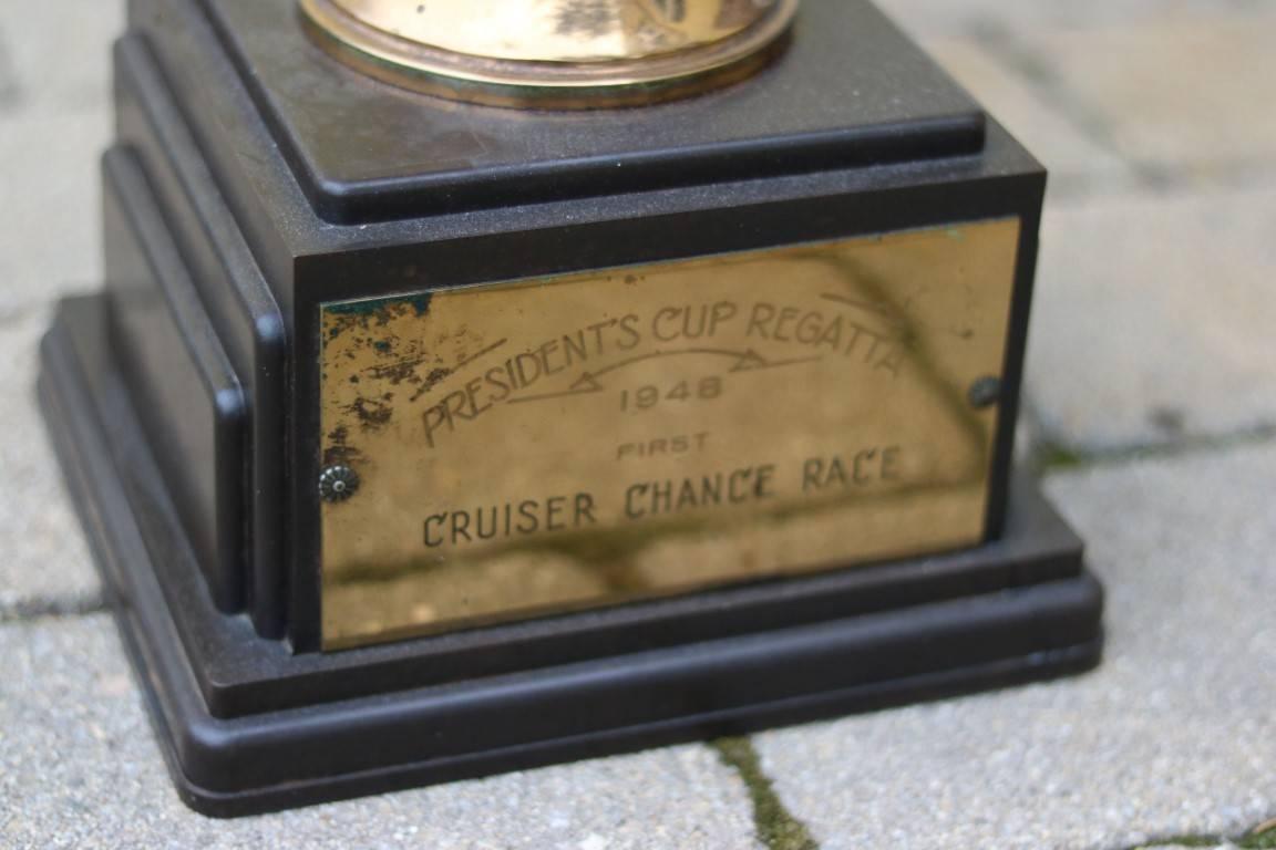 Early racing trophy with engraved front badge reading "President's Cup Regatta 1948 First Cruisers Chance Race".

Dimensions: 27" H x 8" W x 9" L.