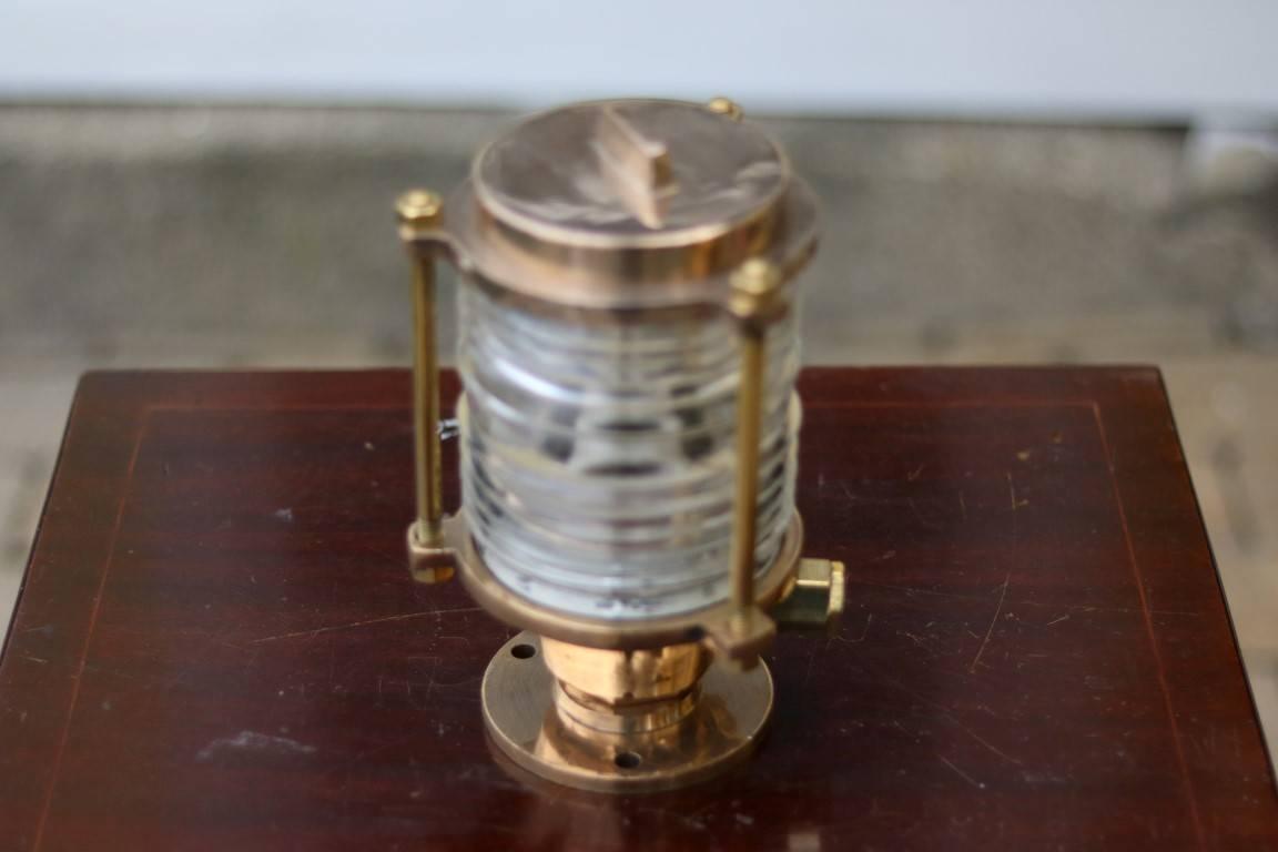 Brass pier light with Fresnel lens. 

Dimensions: 9" H x 5" W.