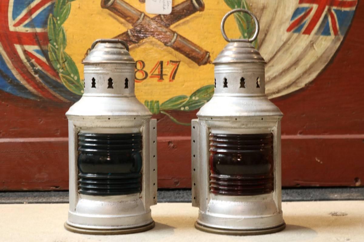Pair of aluminium and brass port and starboard lanterns by Perko. Brass bases and carry handles, vented tops, blue and red Fresnel lenses, rear mounting brackets.