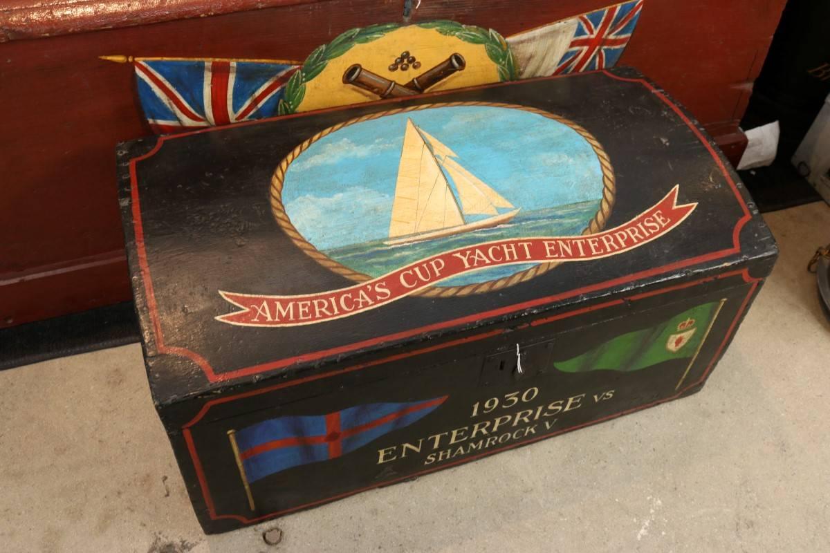 Showing the America's cup yacht enterprise. Chest is old, paint is new. Old paper interior. Dimensions: 28" L x 12" W x 18" H.