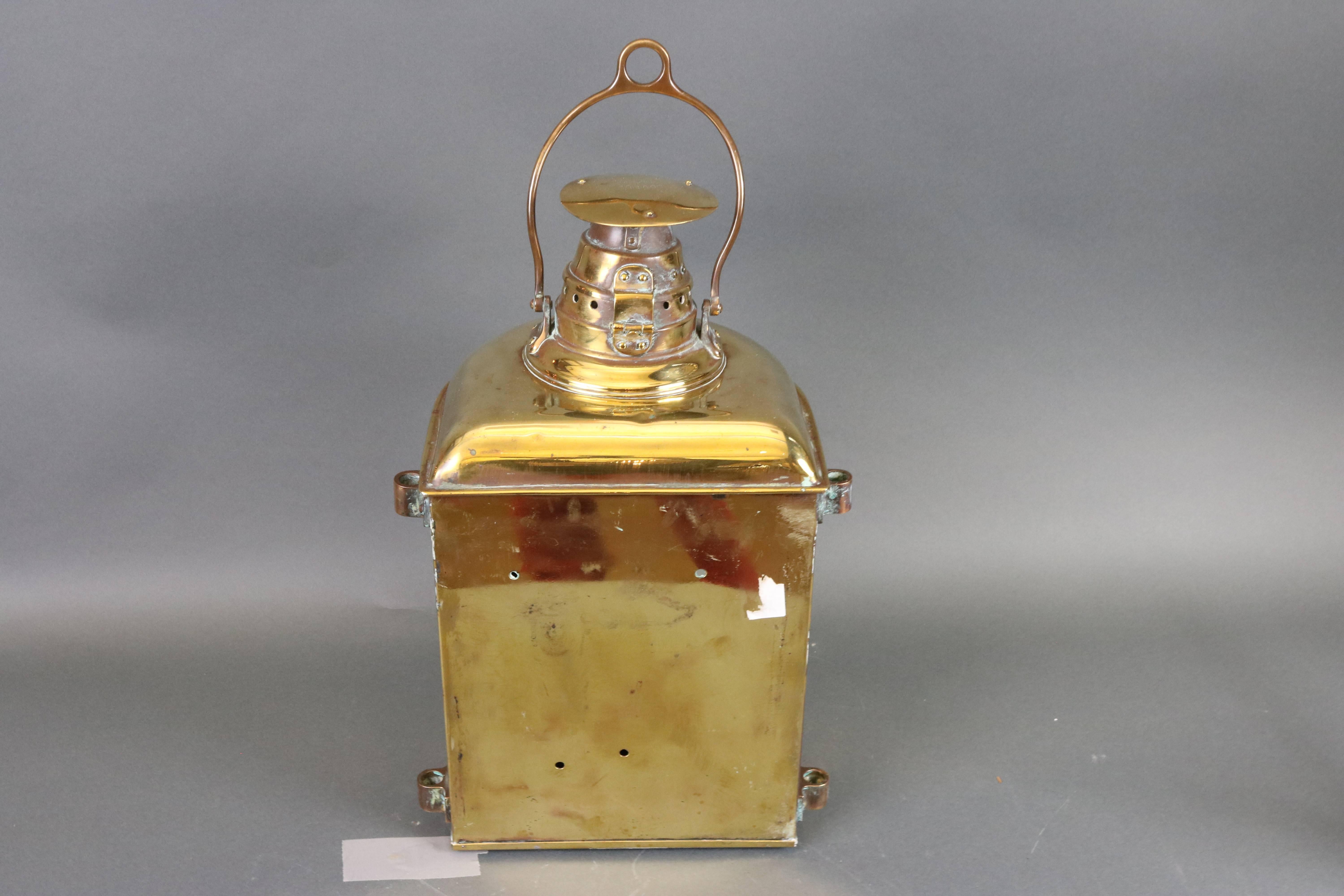 Ship's masthead lantern by Lovell. With corning fresnel glass lens, vented top, carry handle. Dimensions: 13