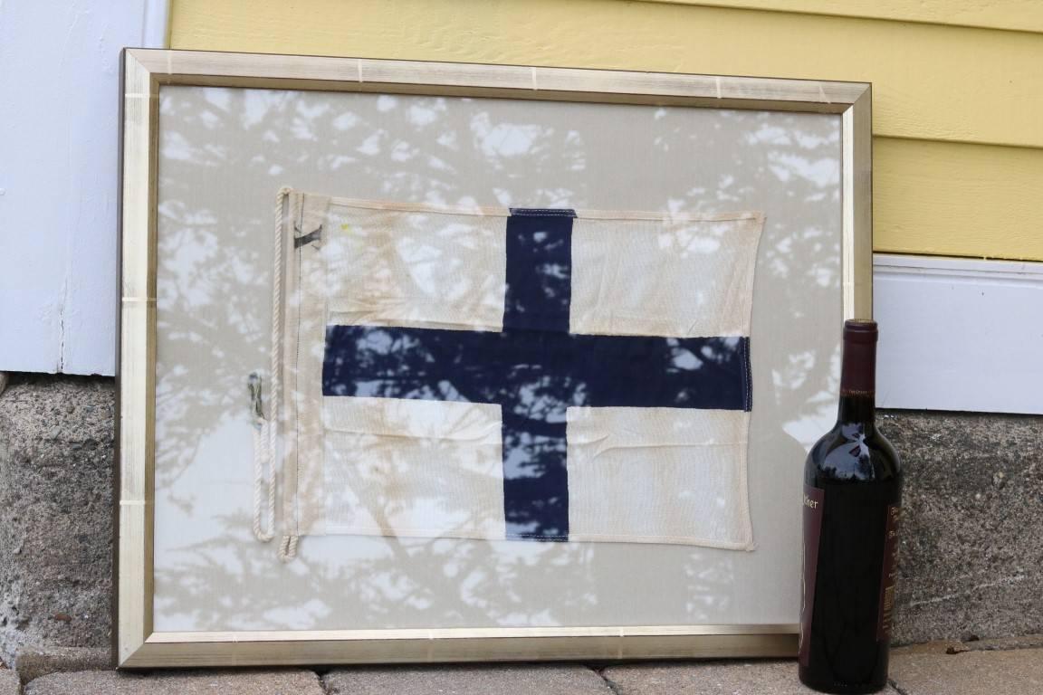 Linen signal flag representing the letter "X". White background with navy blue cross in center. Matted and framed.

Dimensions: 20" H x 26" W.