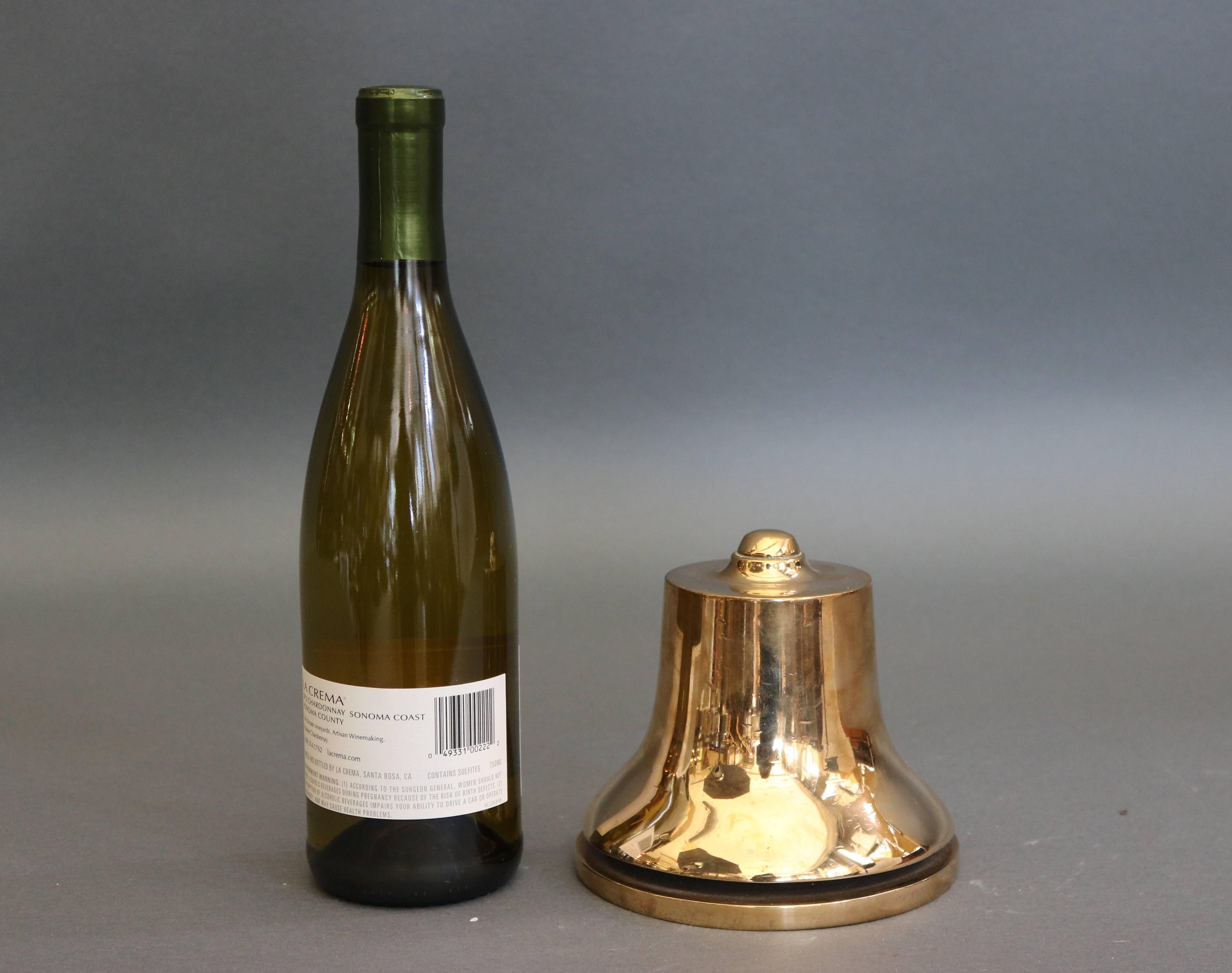 Heavy brass bell by the Green Company of ten walnut St, Kansas city, MO. 

Overall dimensions: 5.5" H x 6" W.