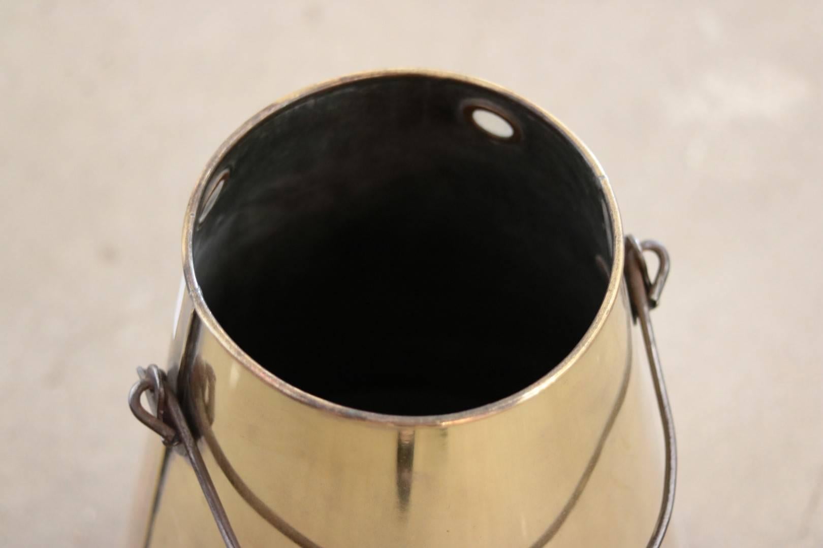 Authentic brass cream bucket with handle.

Dimensions: 19