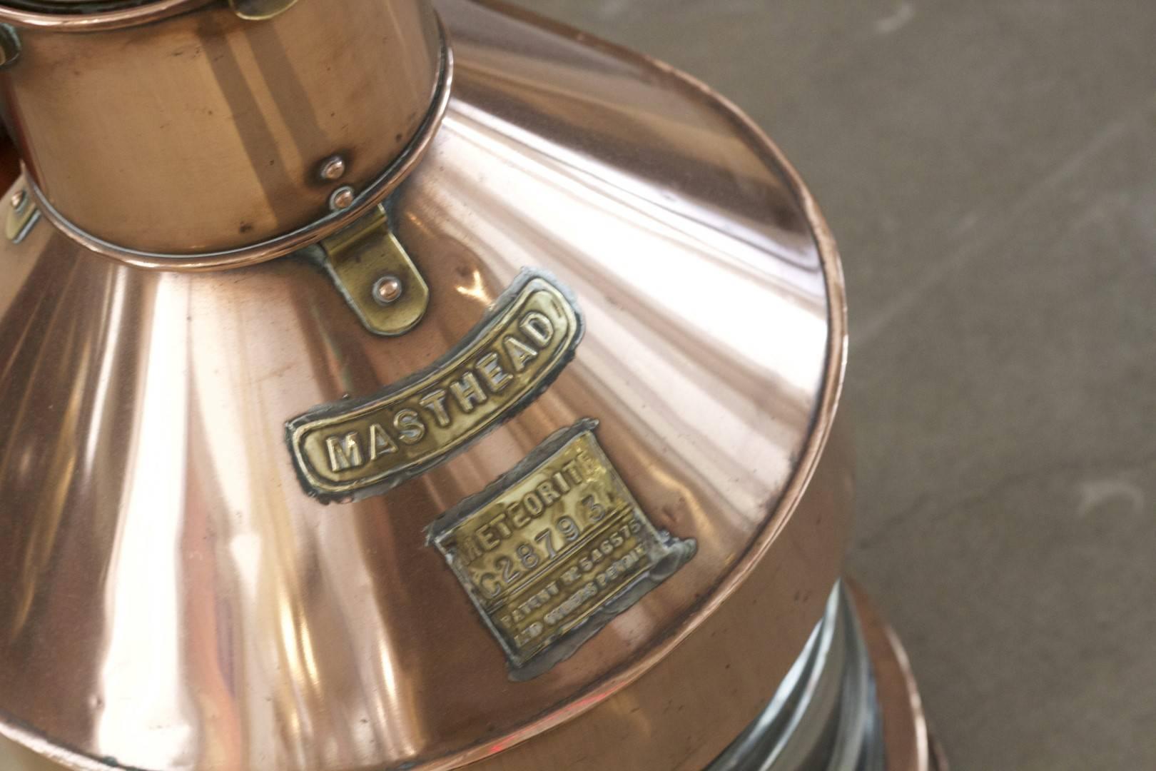 Solid copper and brass masthead lantern with fresnel lens. With maker's badge from English firm 
