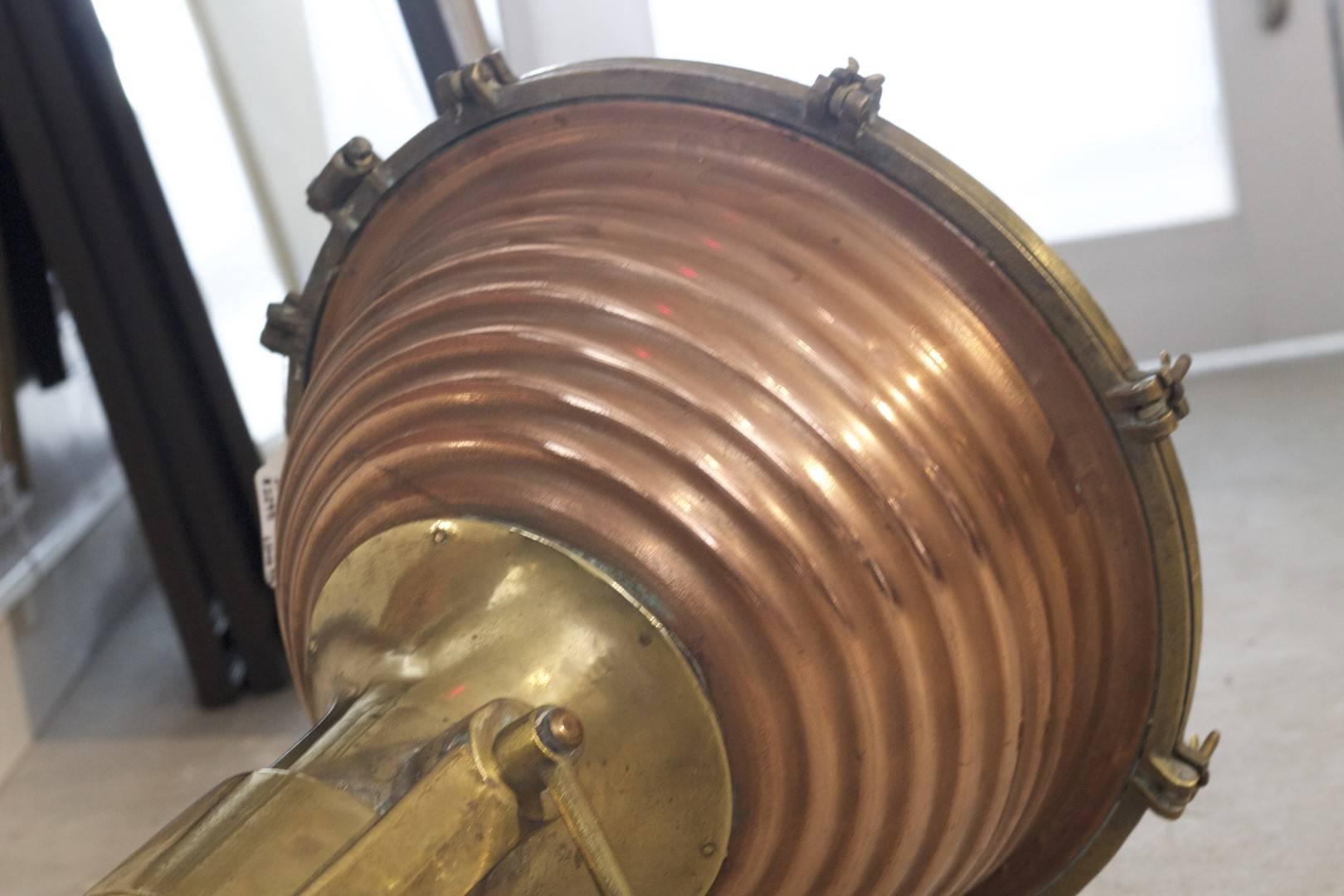 Rippled copper cargo light with hanging bracket. Dimensions: 22